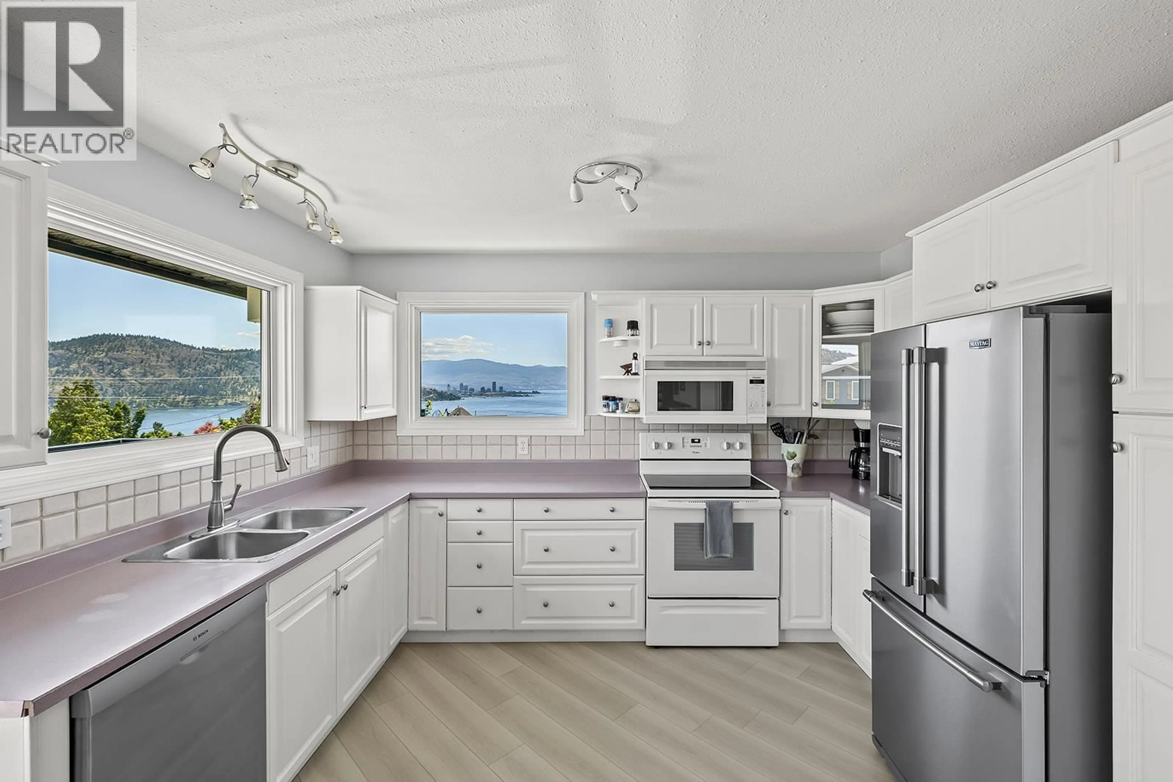 Open concept kitchen, unknown for 145 HELDON COURT, Kelowna British Columbia V1Z3S5