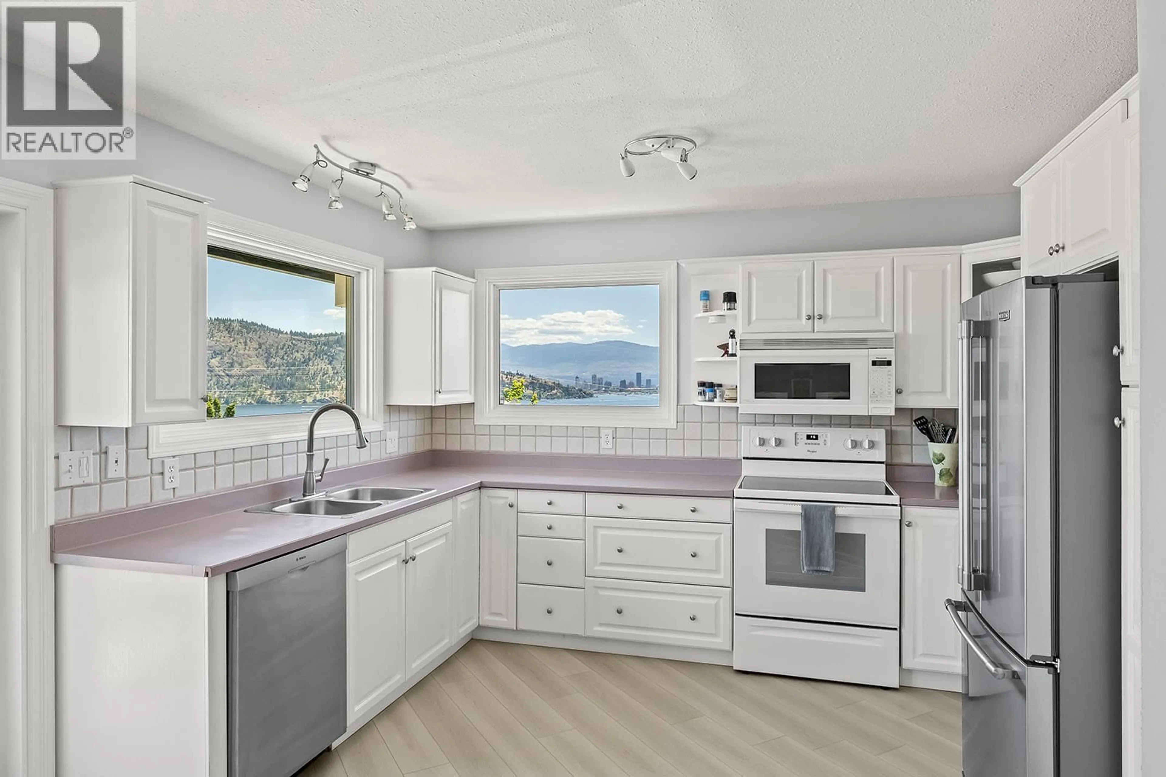 Open concept kitchen, ceramic/tile floor for 145 HELDON COURT, Kelowna British Columbia V1Z3S5