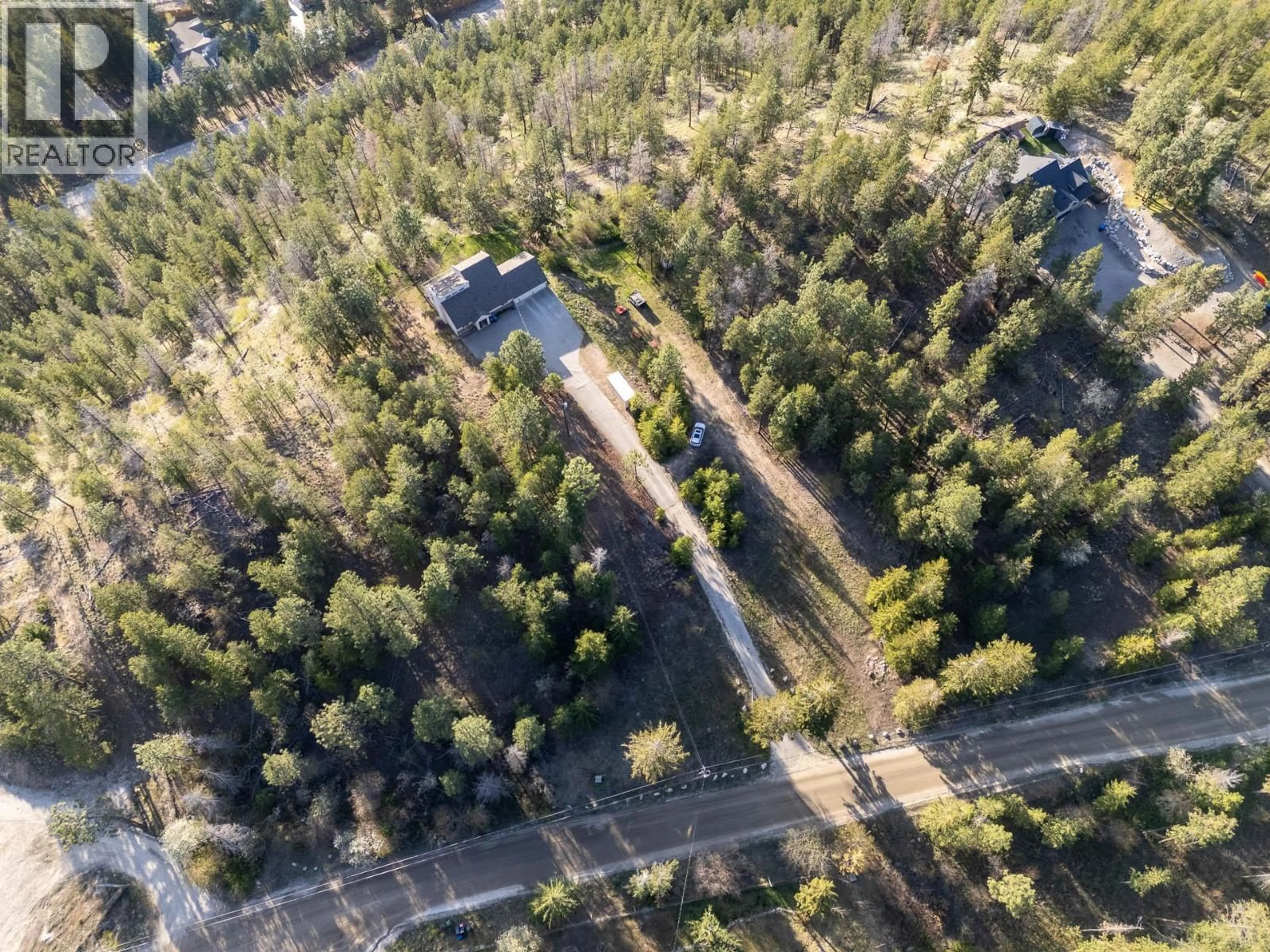 A pic from outside/outdoor area/front of a property/back of a property/a pic from drone, forest/trees view for 15524 BARKLEY ROAD, Lake Country British Columbia V4V1B4
