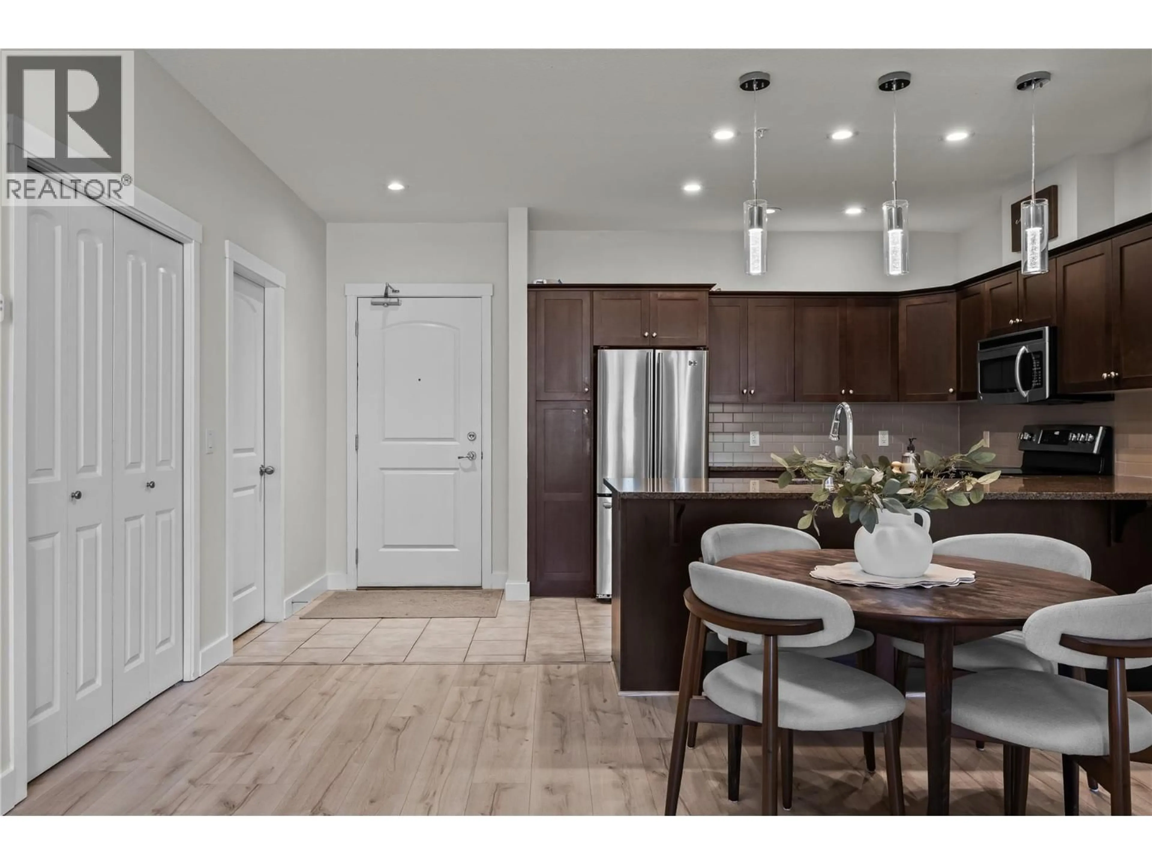 Open concept kitchen, wood/laminate floor for 1112 - 2210 UPPER SUNDANCE DRIVE, West Kelowna British Columbia V4T3E9