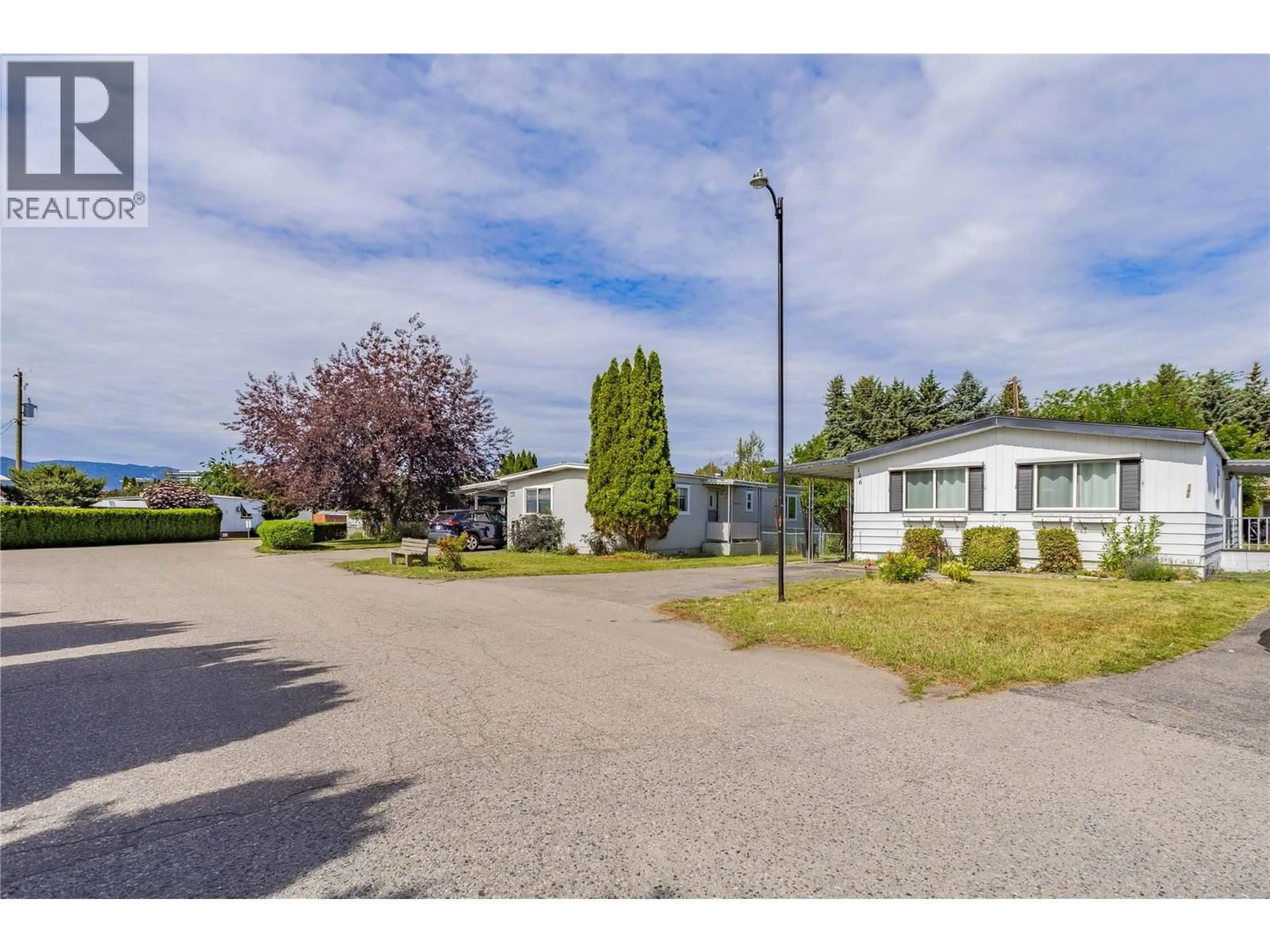 A pic from outside/outdoor area/front of a property/back of a property/a pic from drone, street for 146 - 3745 LAKESHORE ROAD, Kelowna British Columbia V1W3K4