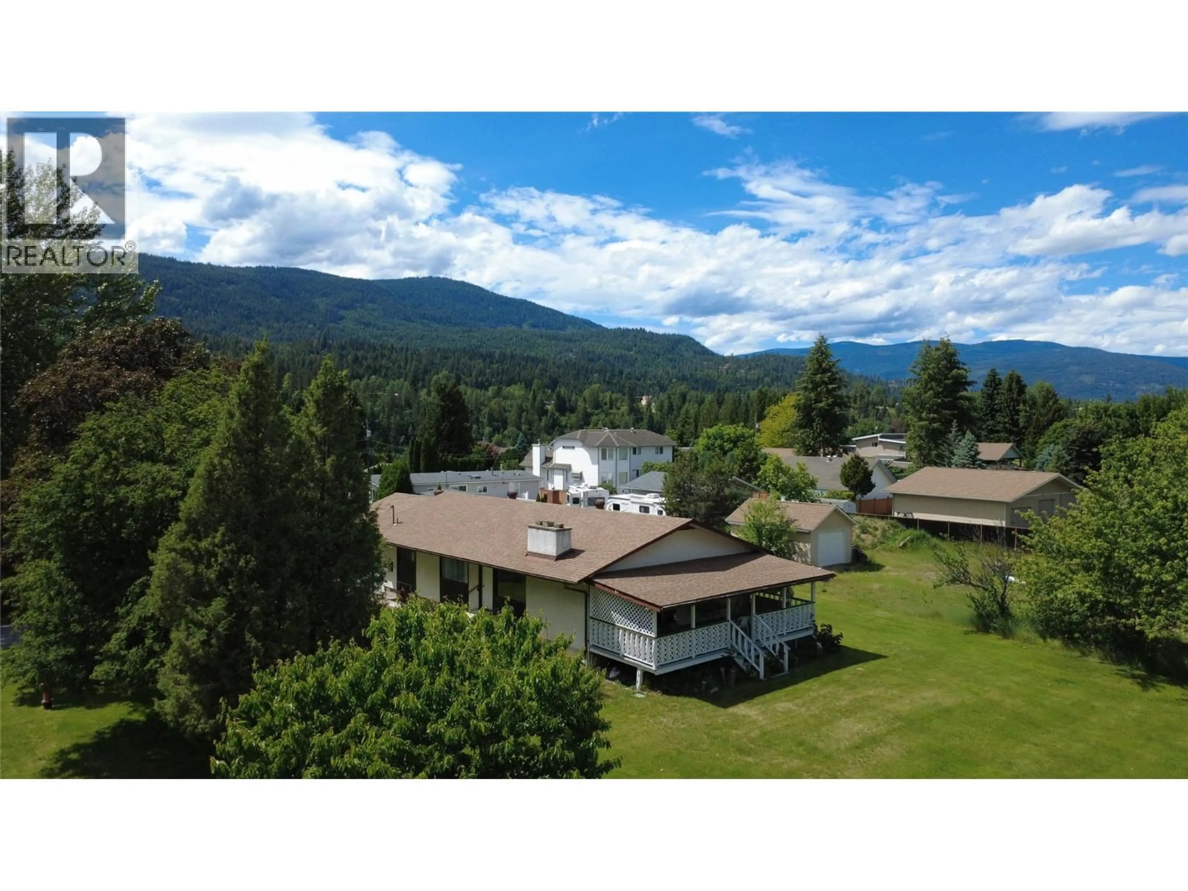 A pic from outside/outdoor area/front of a property/back of a property/a pic from drone, mountain view for 1003 BRIDGEVIEW CRESCENT, Castlegar British Columbia V1N4K9