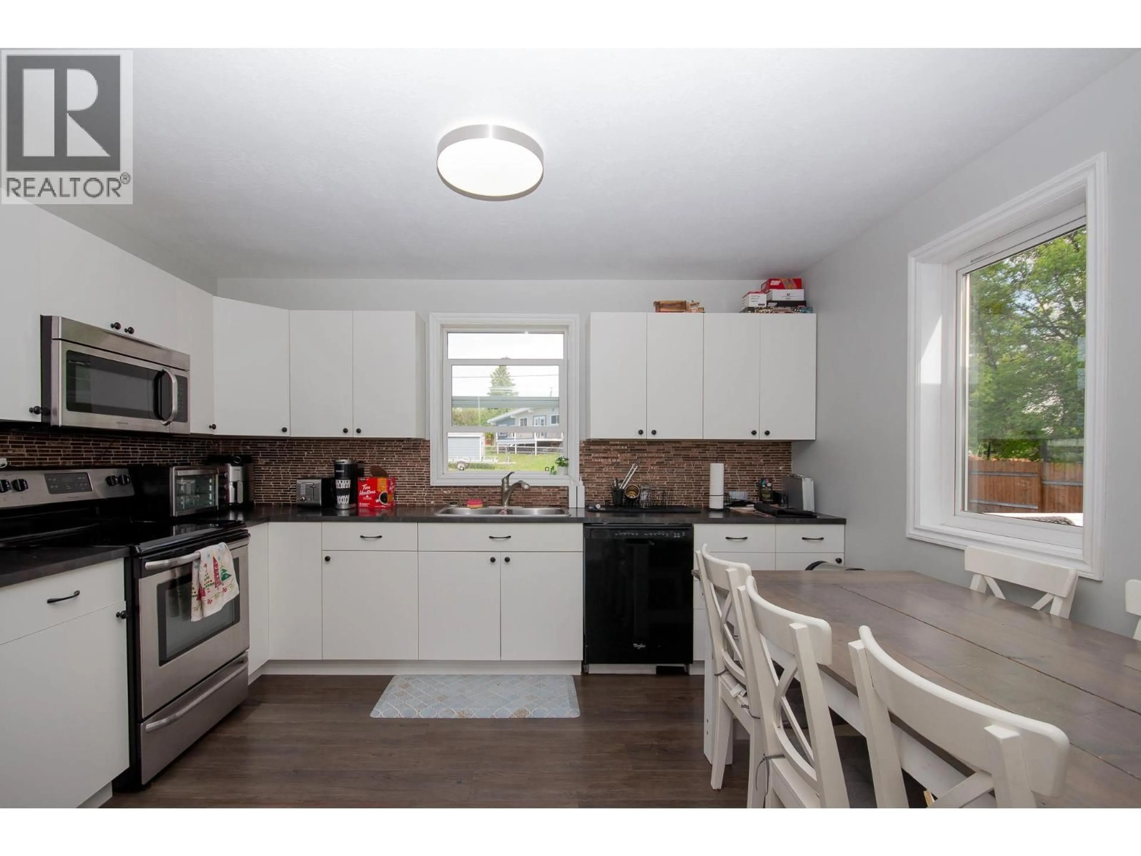Standard kitchen, wood/laminate floor for 9116 8 STREET, Dawson Creek British Columbia V1G3N4