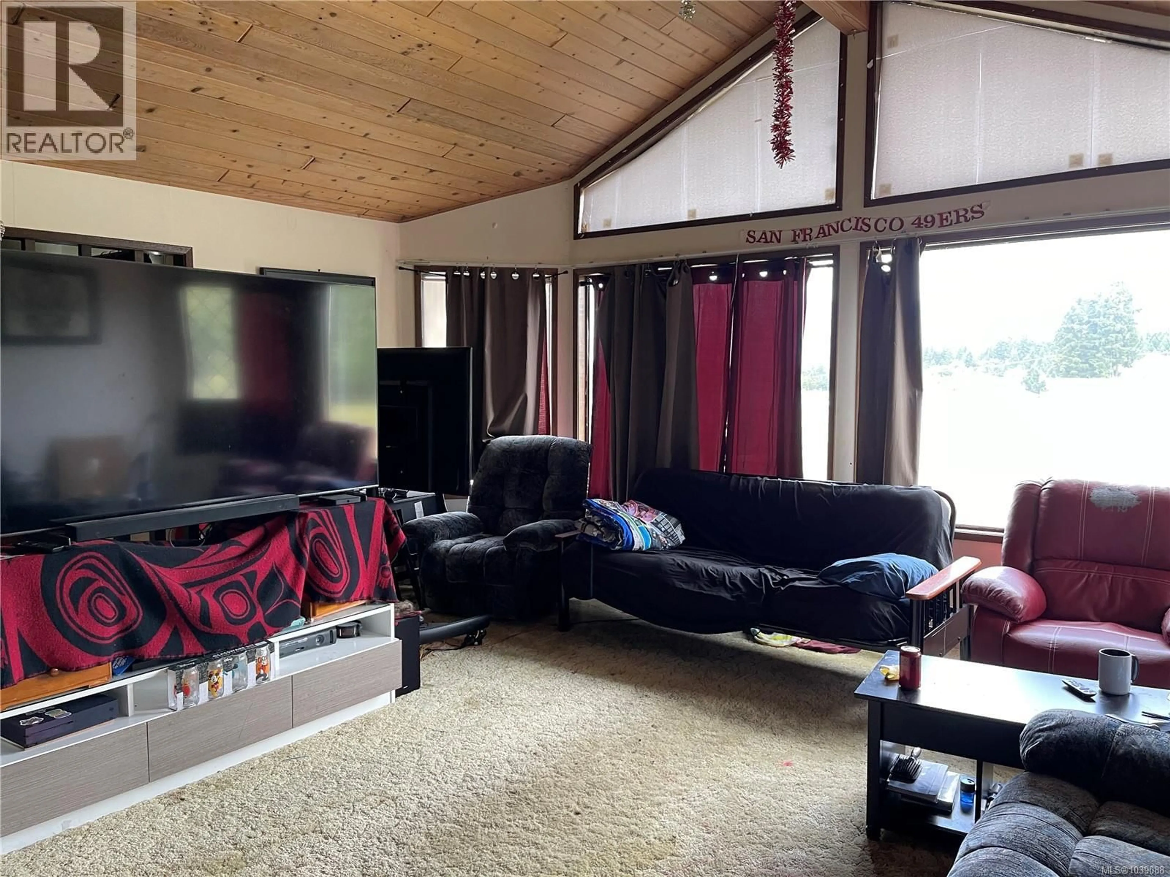 Living room with furniture, wood/laminate floor for 3550 CHINA CREEK ROAD, Port Alberni British Columbia V9Y7V4