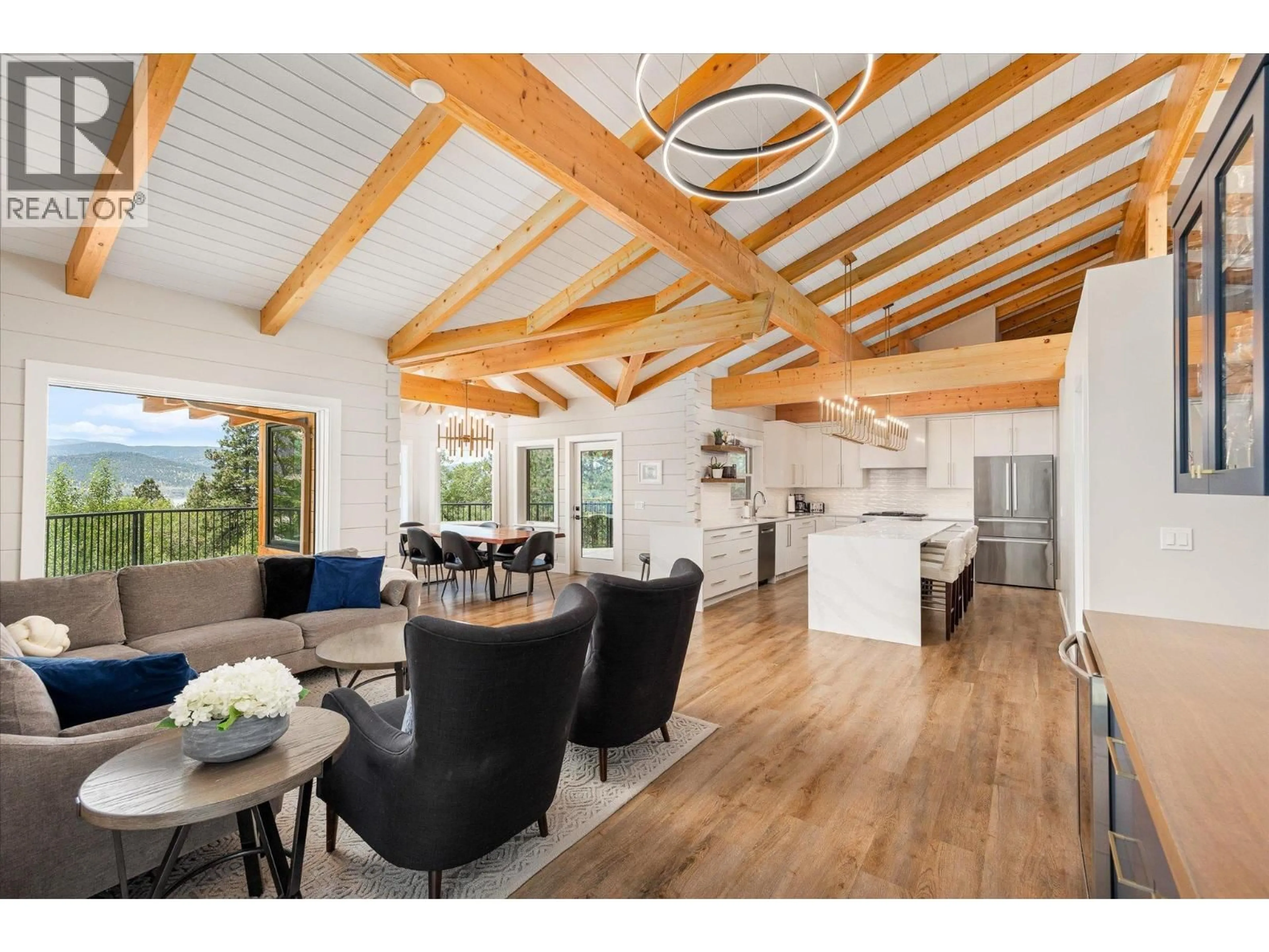 Open concept kitchen, wood/laminate floor for 1055 PEARSON ROAD, Penticton British Columbia V2A8T9
