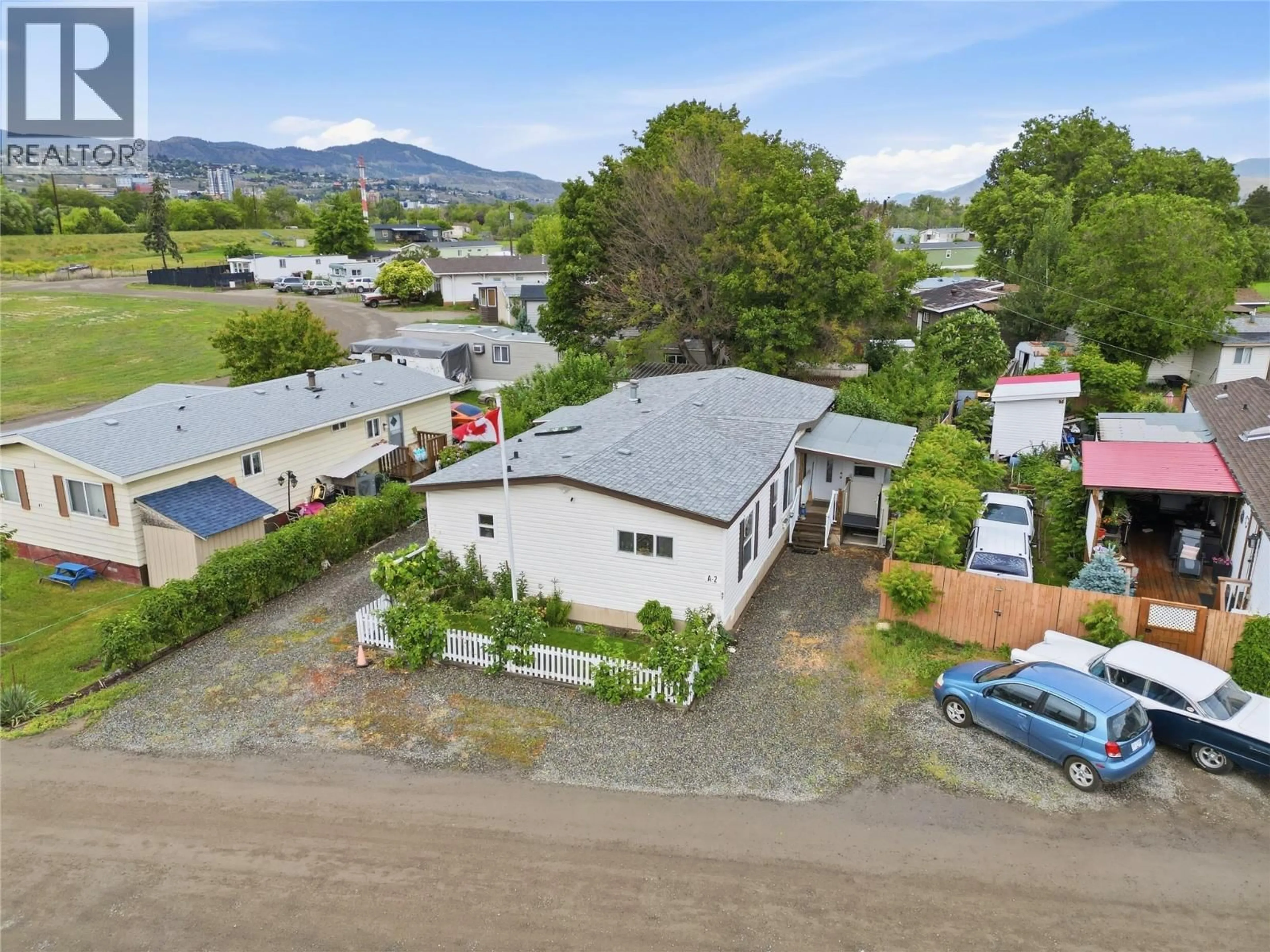 A pic from outside/outdoor area/front of a property/back of a property/a pic from drone, mountain view for A2 - 220 G & M ROAD, Kamloops British Columbia V2H1A4
