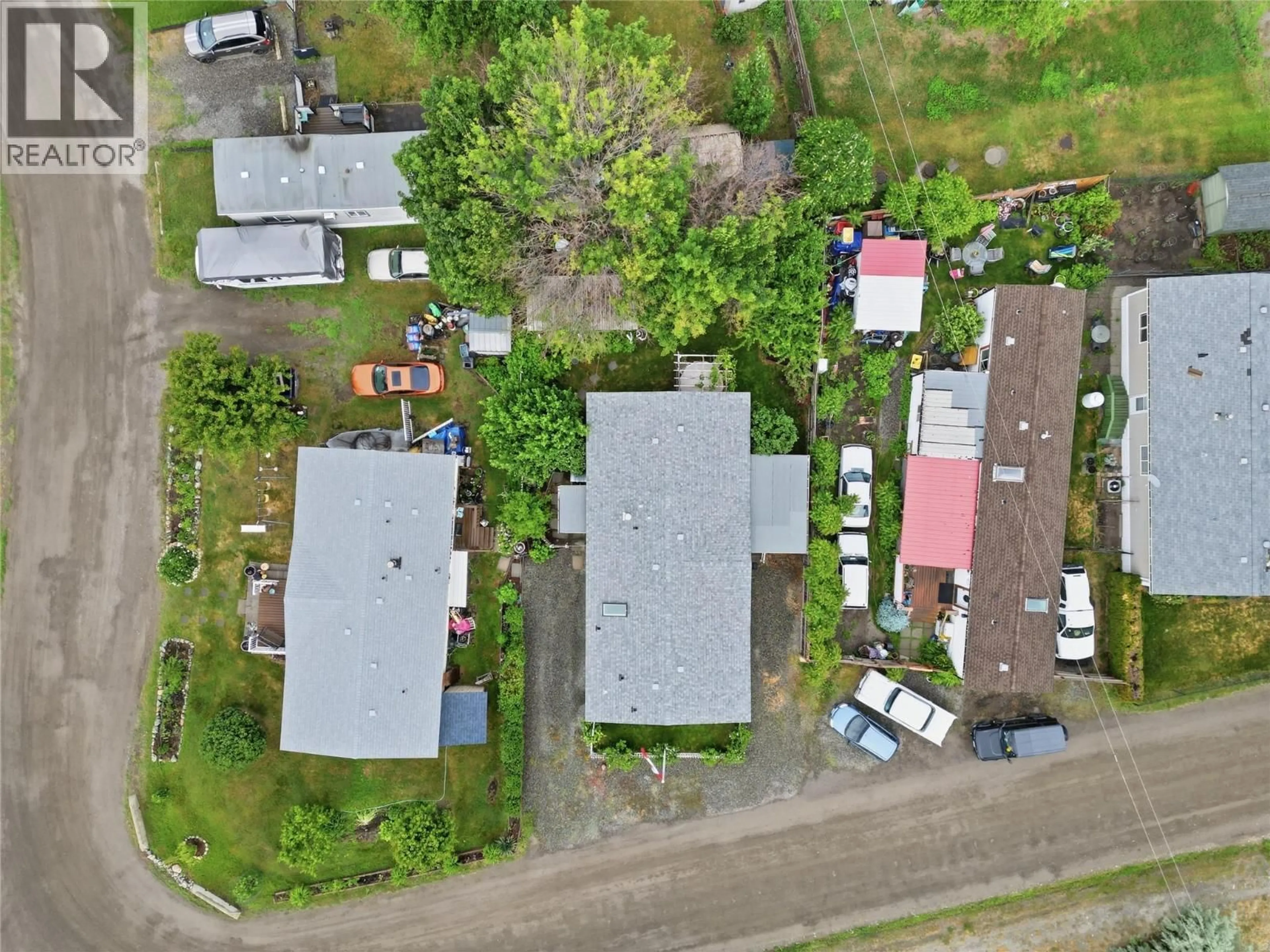 A pic from outside/outdoor area/front of a property/back of a property/a pic from drone, street for A2 - 220 G & M ROAD, Kamloops British Columbia V2H1A4