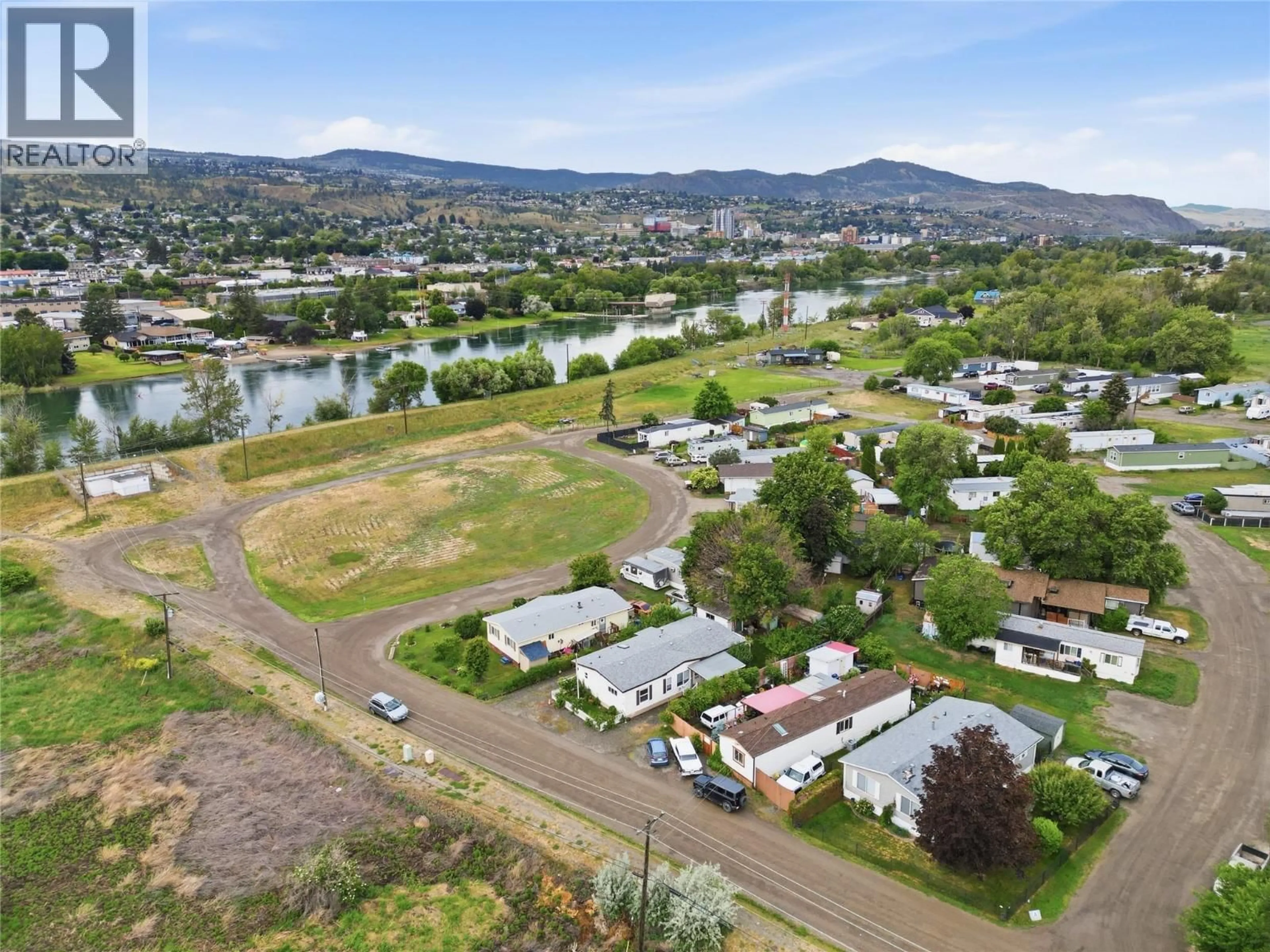 A pic from outside/outdoor area/front of a property/back of a property/a pic from drone, mountain view for A2 - 220 G & M ROAD, Kamloops British Columbia V2H1A4