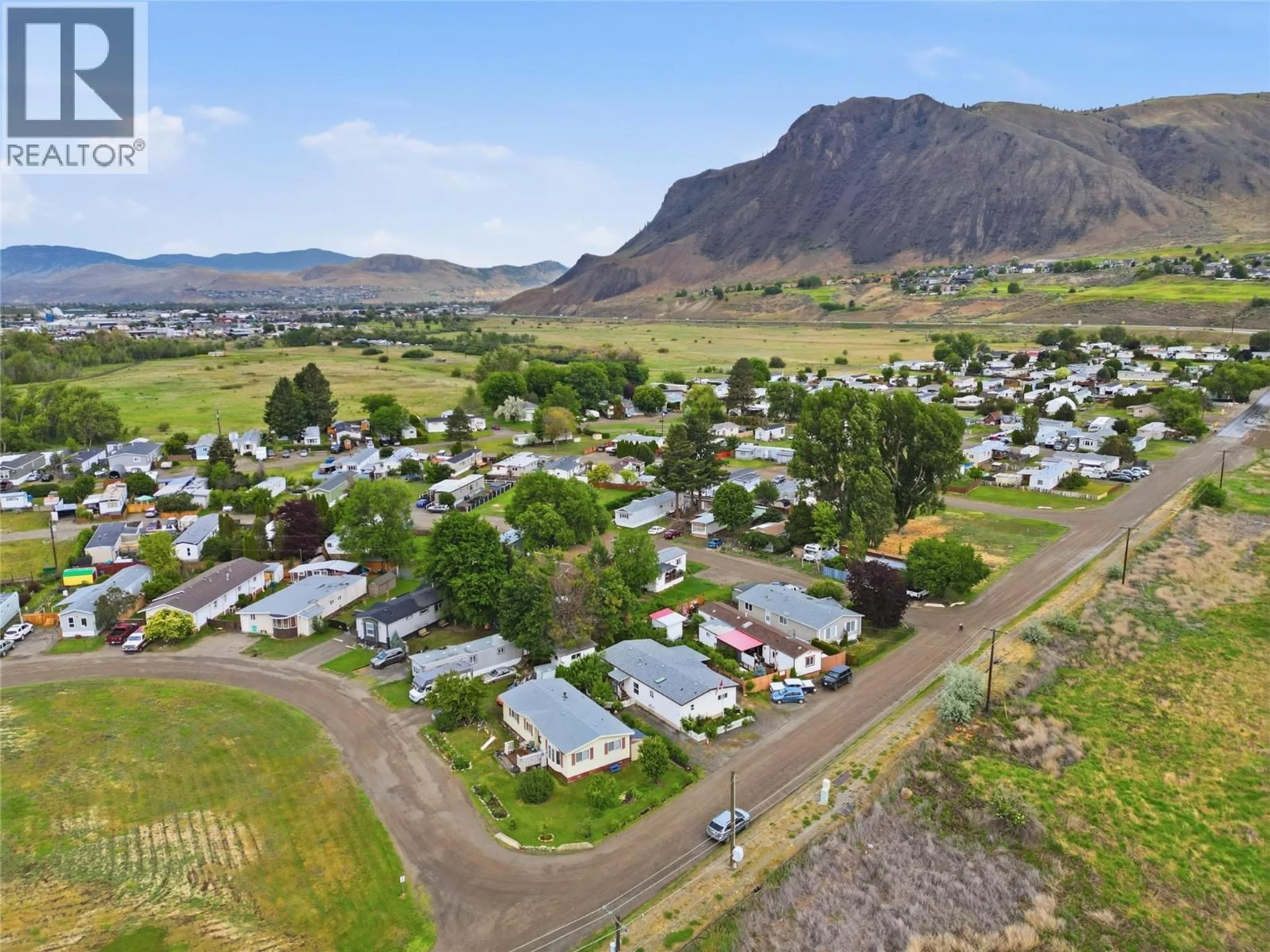 A pic from outside/outdoor area/front of a property/back of a property/a pic from drone, mountain view for A2 - 220 G & M ROAD, Kamloops British Columbia V2H1A4