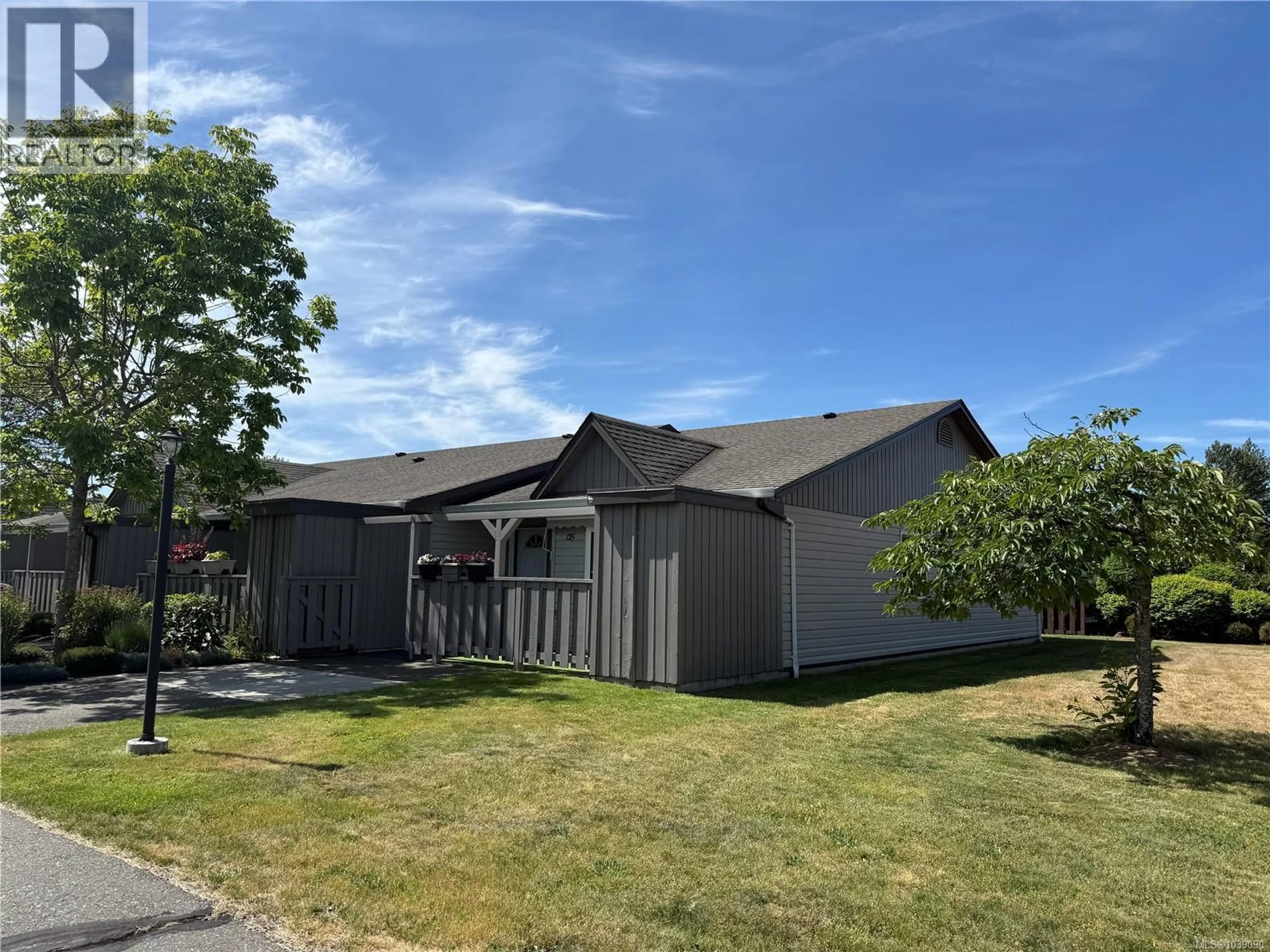 A pic from outside/outdoor area/front of a property/back of a property/a pic from drone, street for 125 - 2191 MURRELET DRIVE, Comox British Columbia V9M3Y1