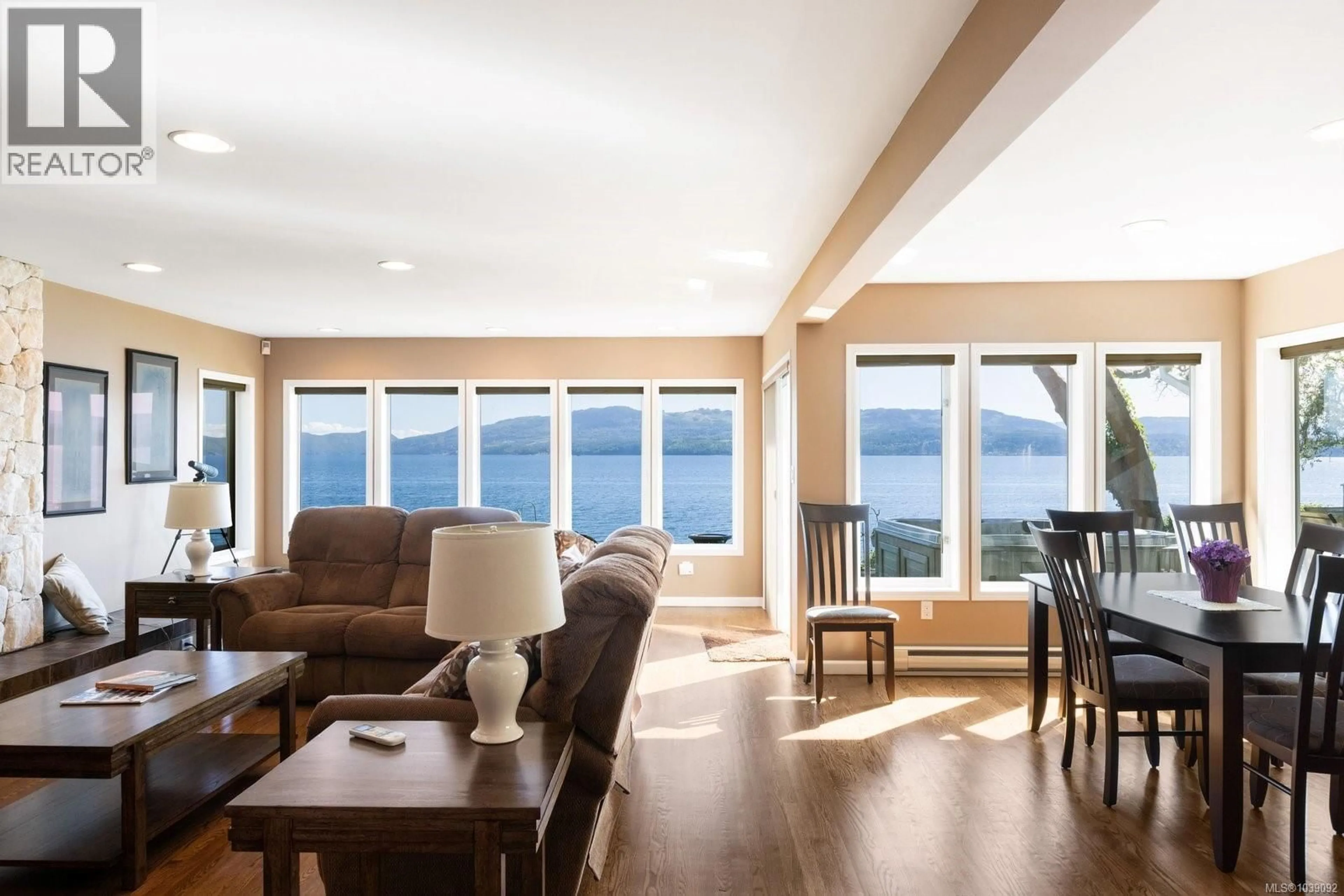 Living room with furniture, wood/laminate floor for 10652 MADRONA DRIVE, North Saanich British Columbia V8L5L8