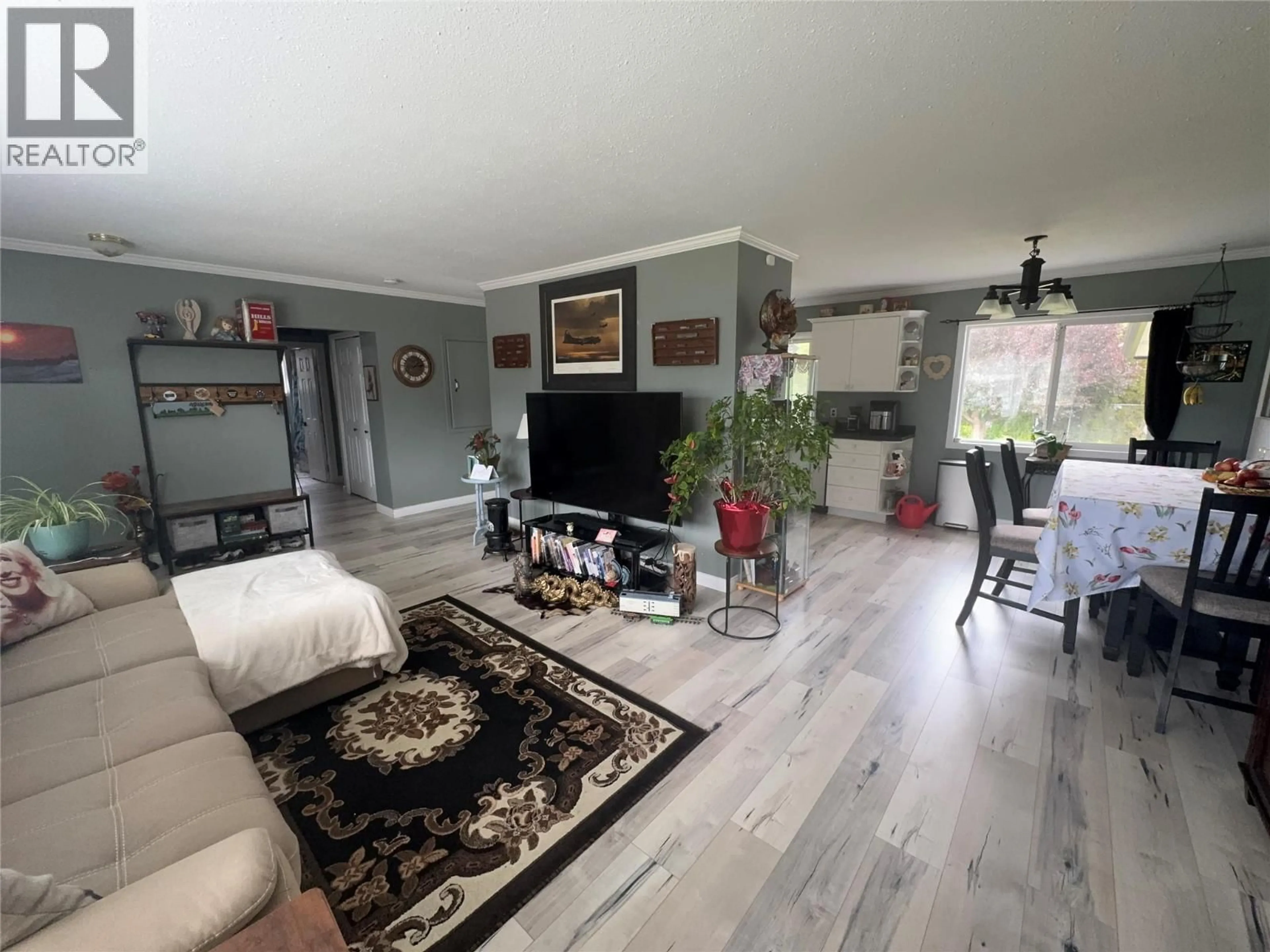 Living room with furniture, wood/laminate floor for 2225 MERRITT AVENUE, Merritt British Columbia V1K1B8
