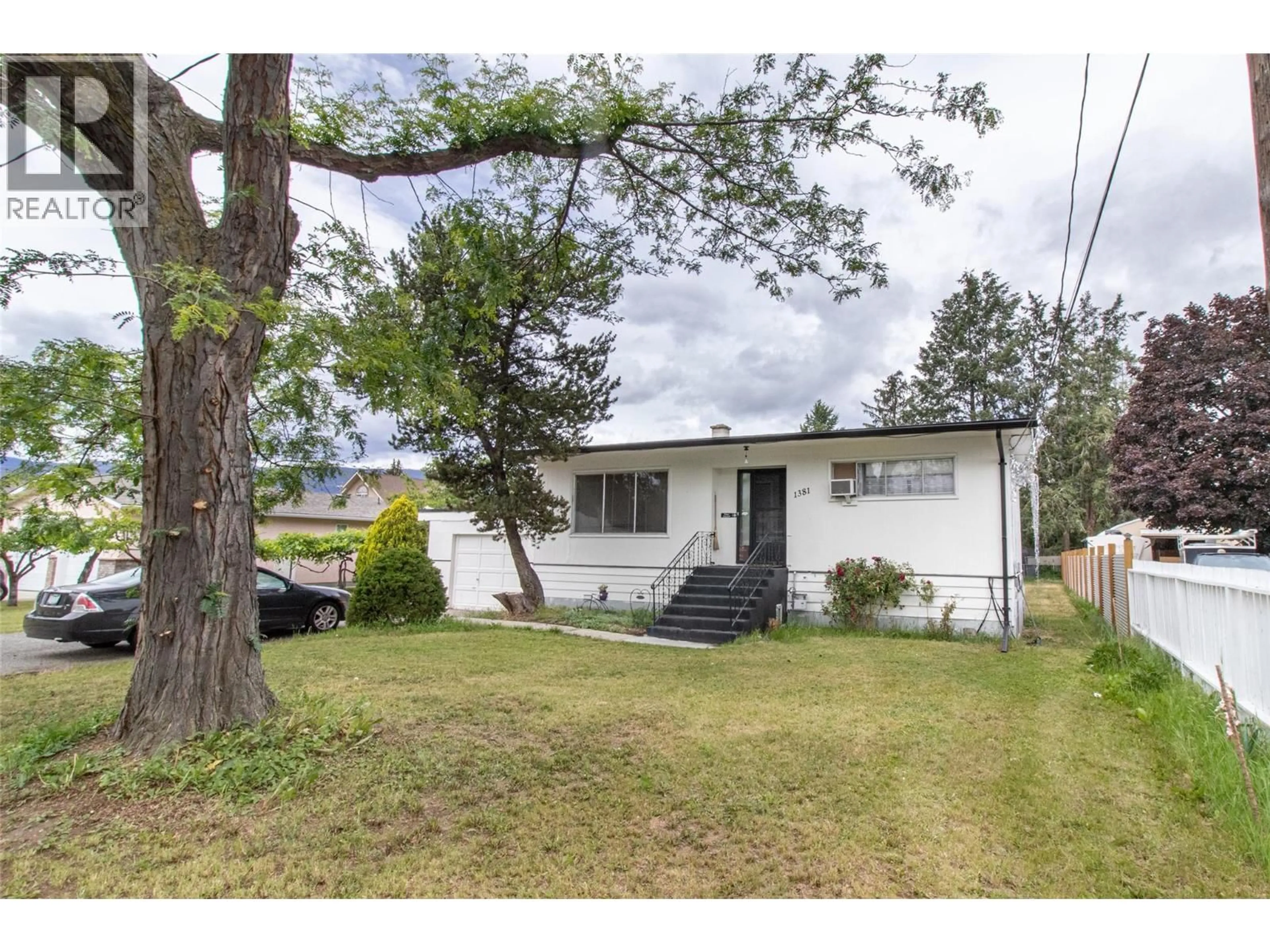 Home with vinyl exterior material, street for 1381 MCBRIDE ROAD, Kelowna British Columbia V1Y4A5