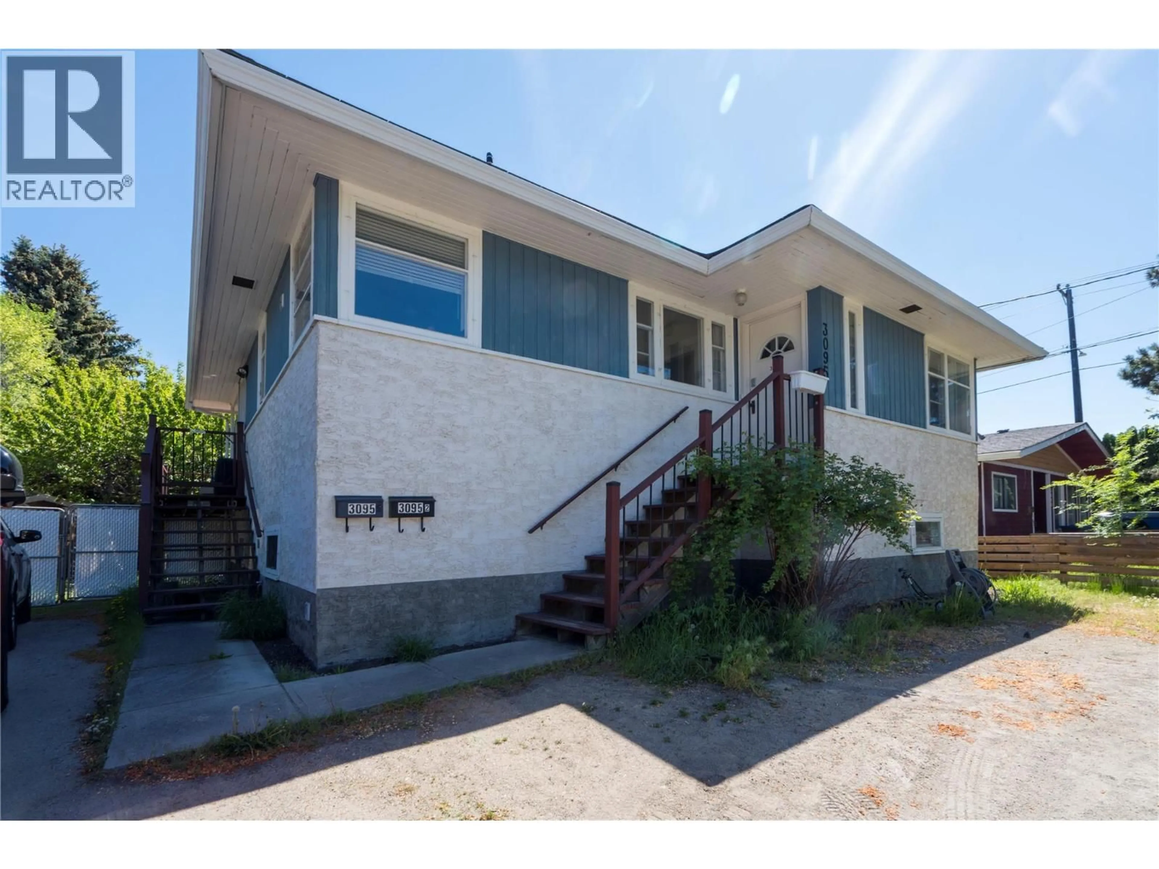 Home with vinyl exterior material, street for 3095 GORDON DRIVE, Kelowna British Columbia V1W3R1