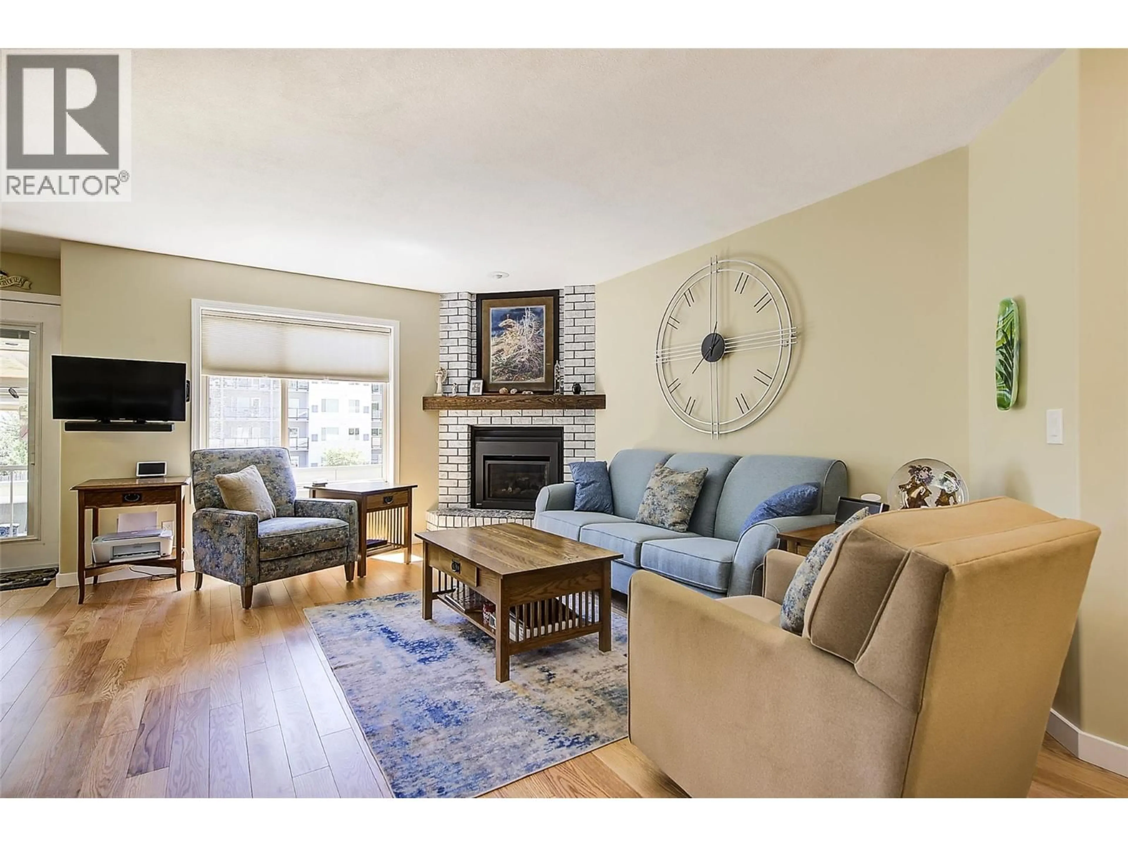 Living room with furniture, wood/laminate floor for 123 - 2330 BUTT ROAD, West Kelowna British Columbia V4T2L3