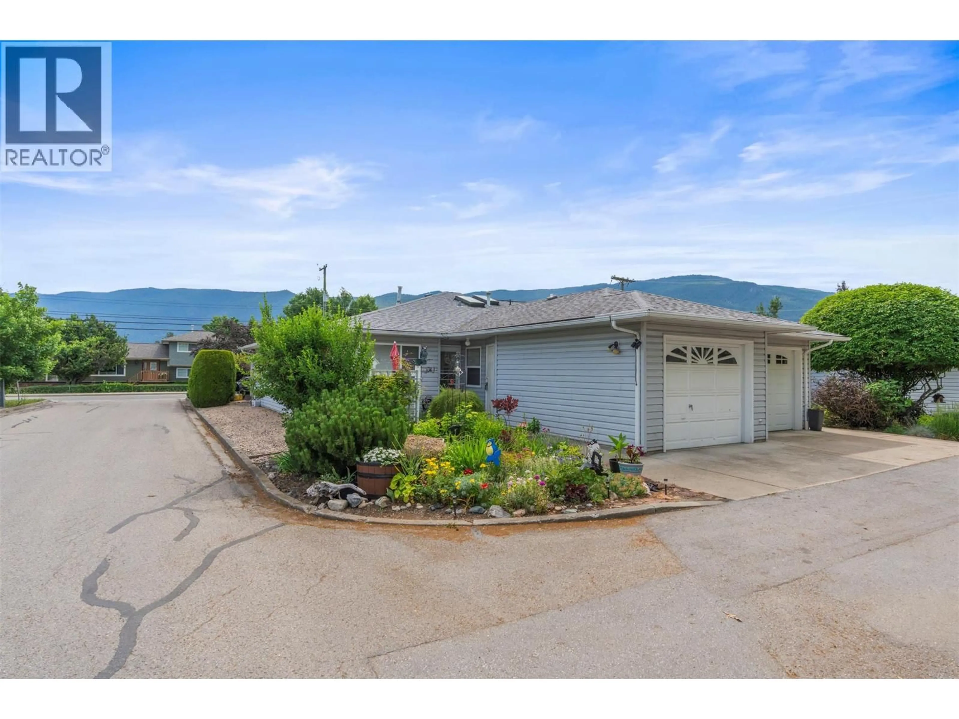 A pic from outside/outdoor area/front of a property/back of a property/a pic from drone, mountain view for 1 - 2435 PLEASANT VALLEY ROAD, Armstrong British Columbia V4Y2A3