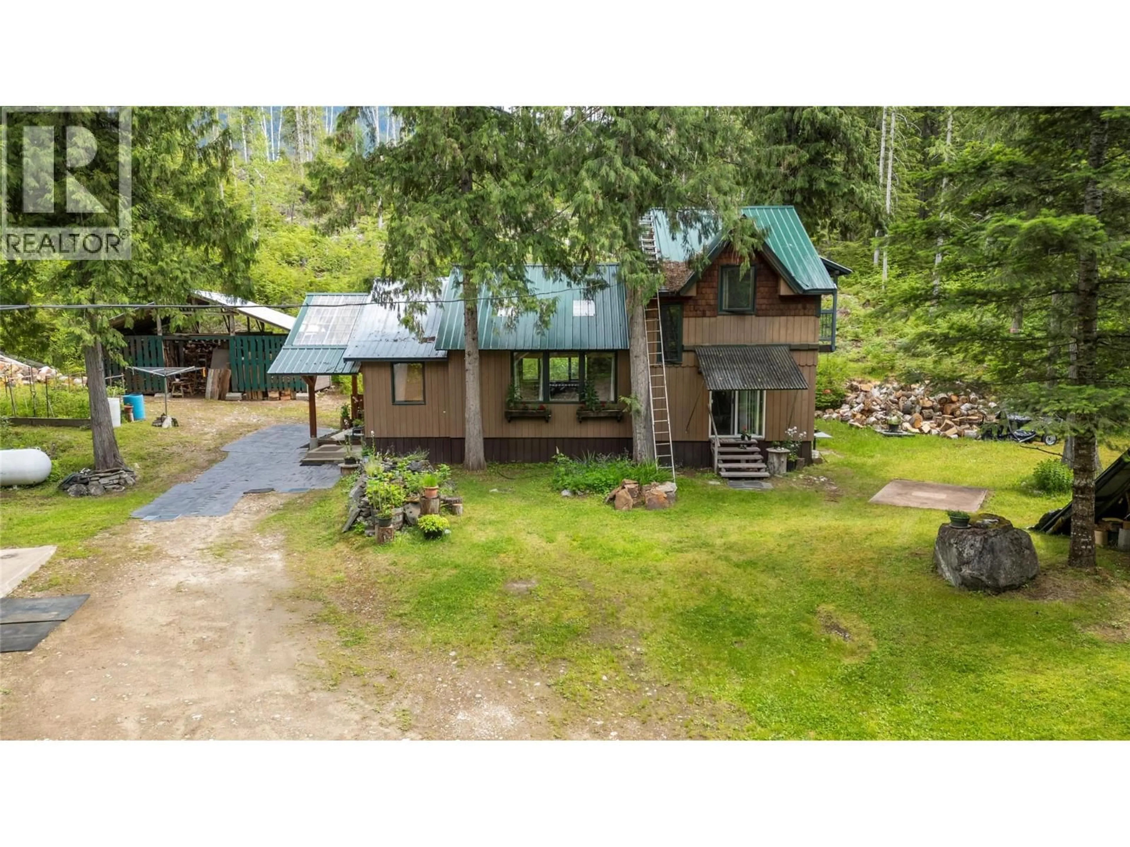 A pic from outside/outdoor area/front of a property/back of a property/a pic from drone, water/lake/river/ocean view for 1598 QUAST ROAD, Seymour Arm British Columbia V0E2V2