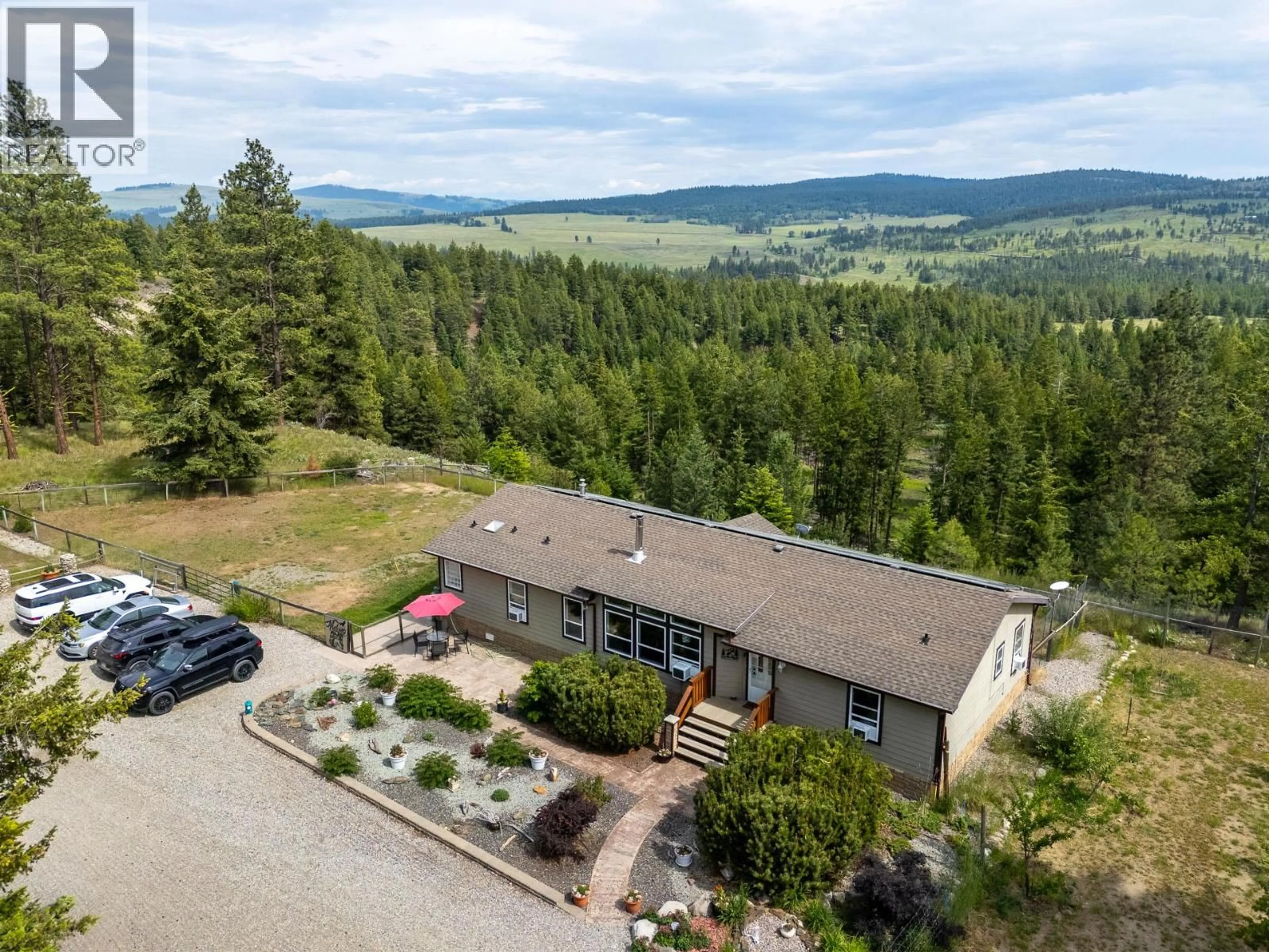 A pic from outside/outdoor area/front of a property/back of a property/a pic from drone, mountain view for 38 NINE MILE PLACE, Osoyoos British Columbia V0H1V6