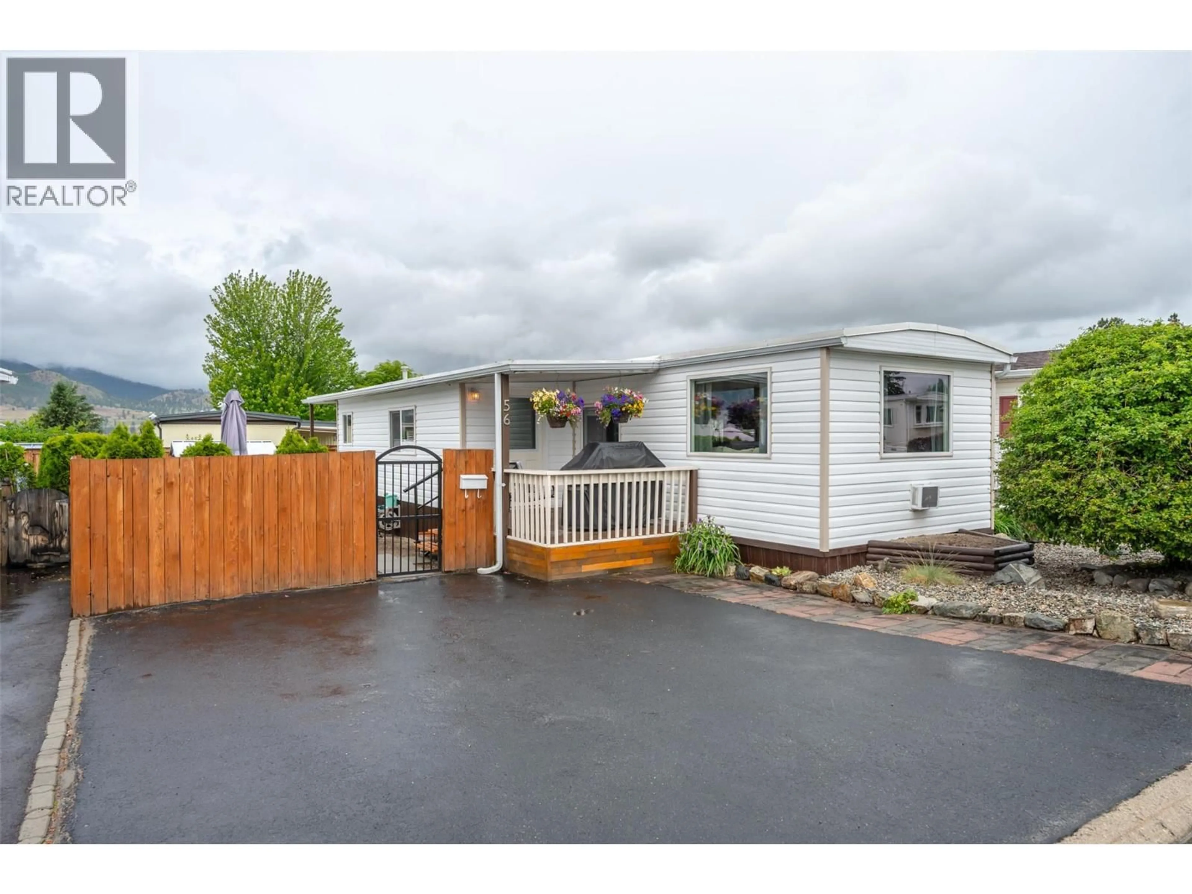Home with vinyl exterior material, street for 56 - 98 OKANAGAN AVENUE EAST, Penticton British Columbia V2A3J5