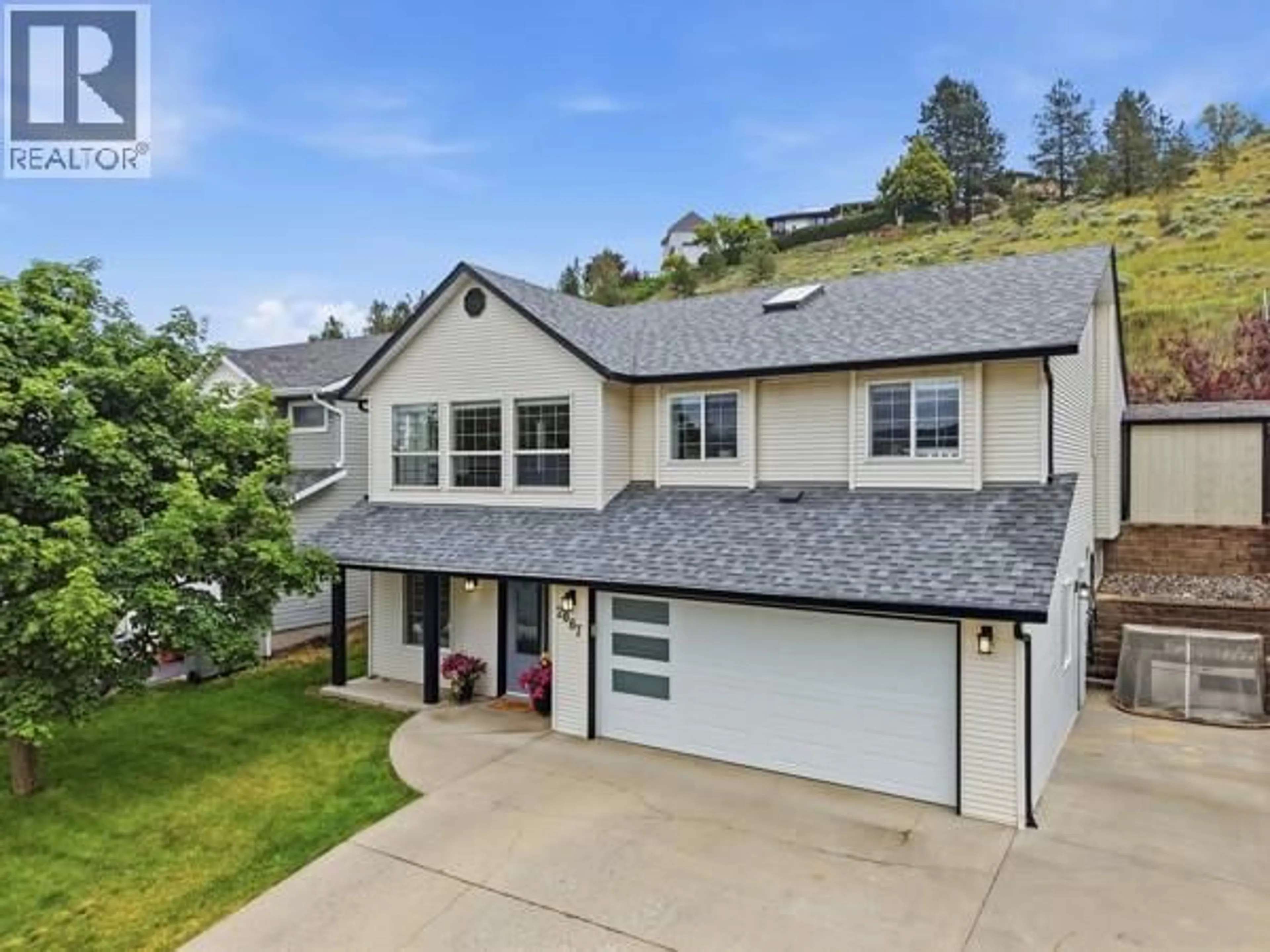 A pic from outside/outdoor area/front of a property/back of a property/a pic from drone, mountain view for 2087 TREMERTON DRIVE, Kamloops British Columbia V2E2K7