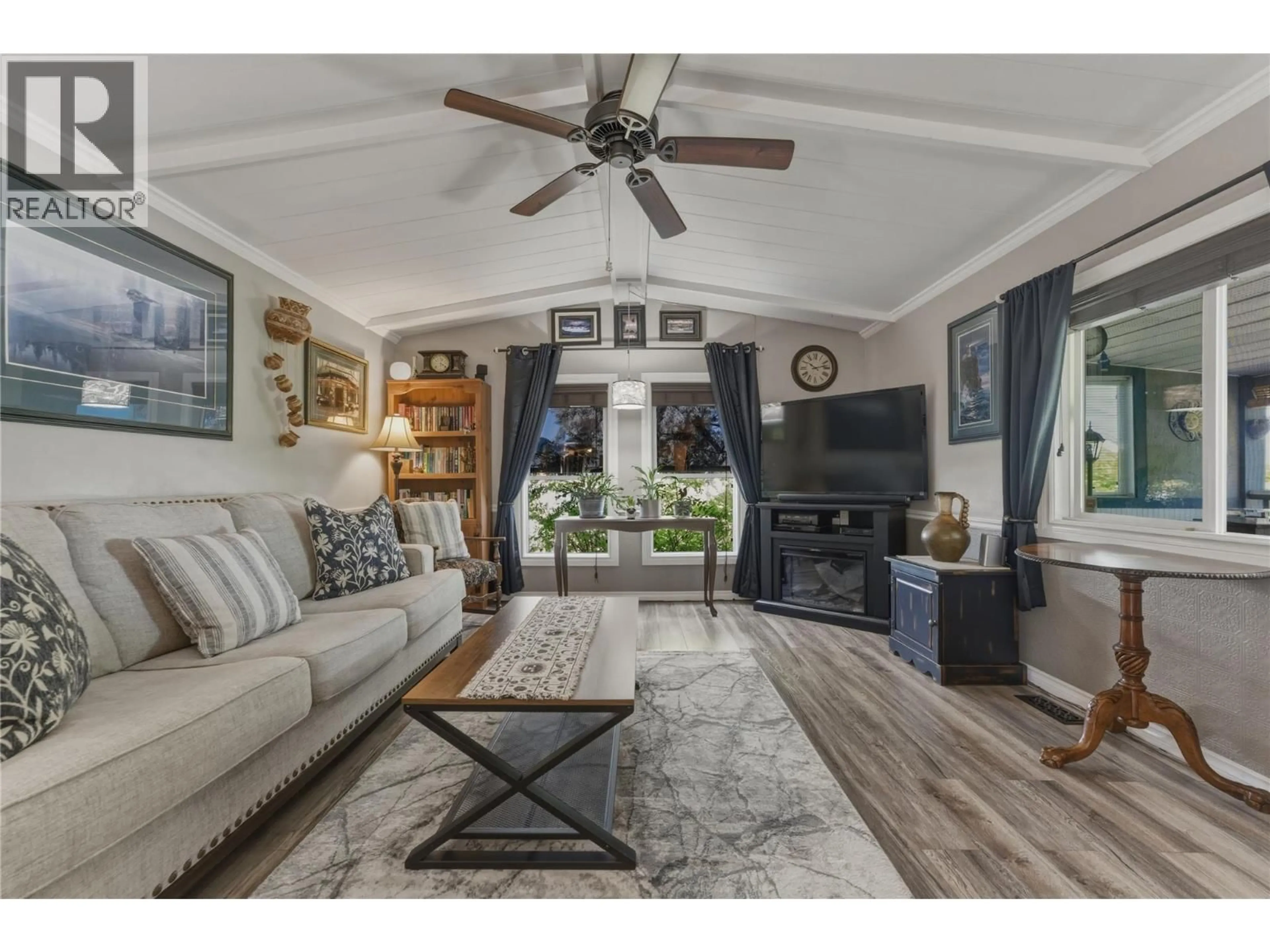 Living room with furniture, unknown for 6960 PLEASANT VALLEY ROAD, Vernon British Columbia V1B3R5