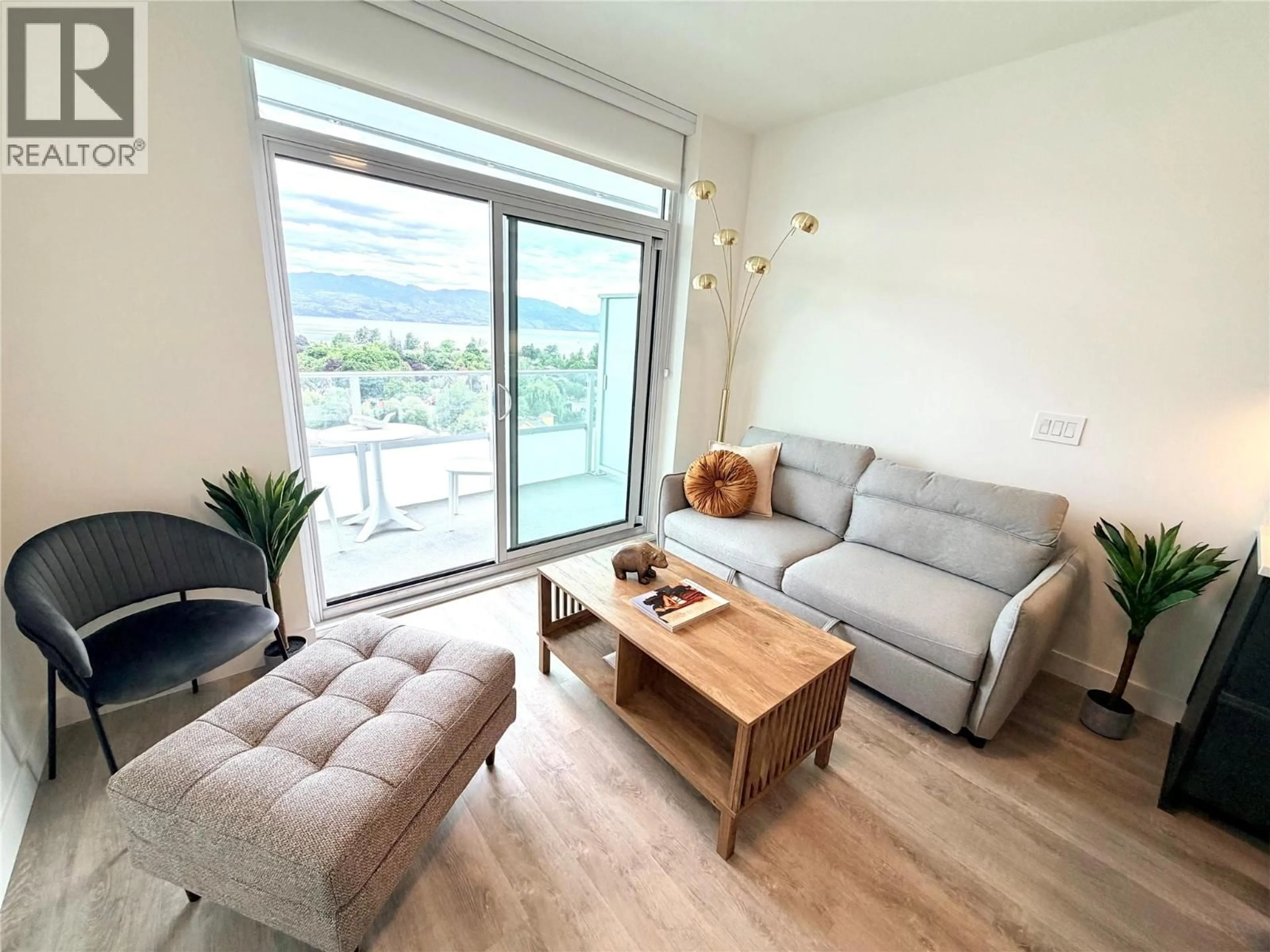 Living room with furniture, wood/laminate floor for 1206 - 1626 WATER STREET, Kelowna British Columbia V1Y1J9