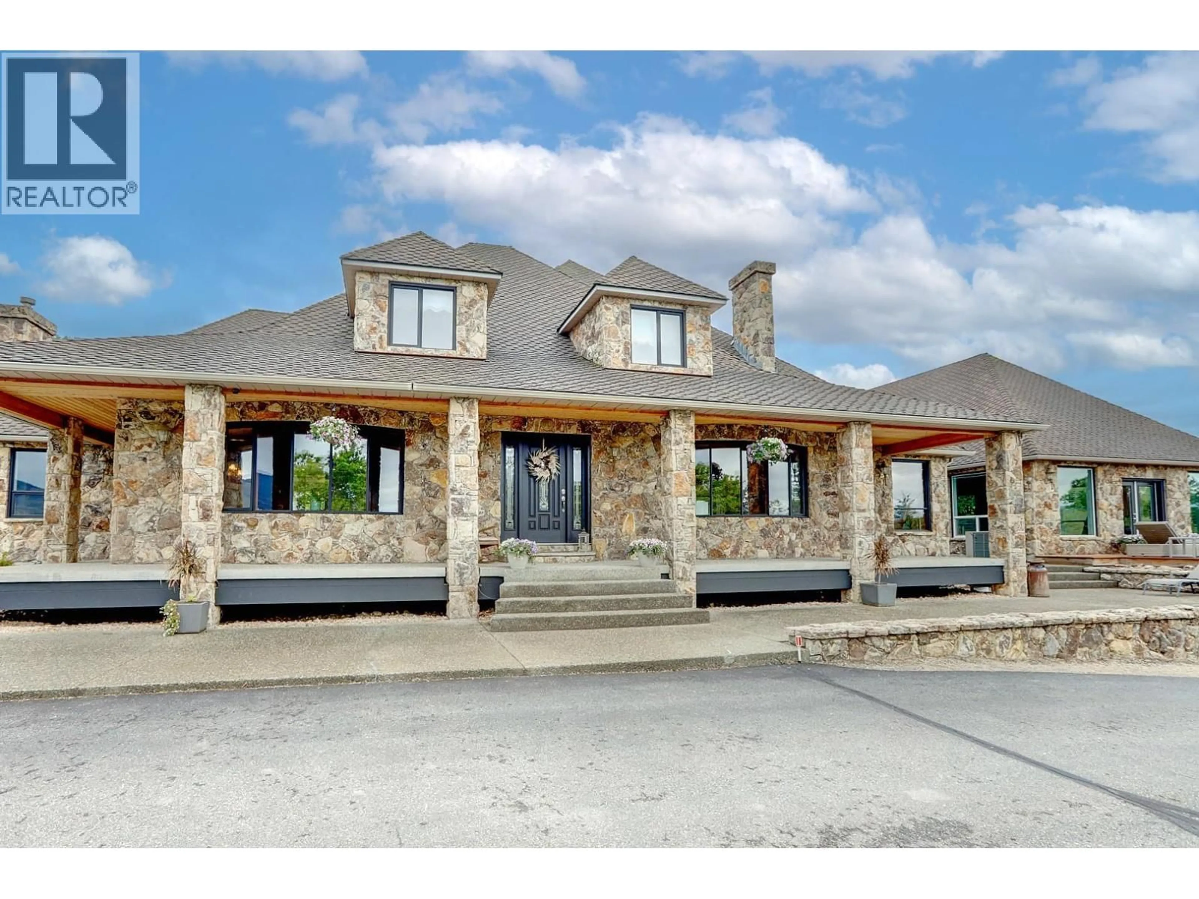 Home with brick exterior material, unknown for 10802 COLDSTREAM CREEK ROAD, Coldstream British Columbia V1B1C9