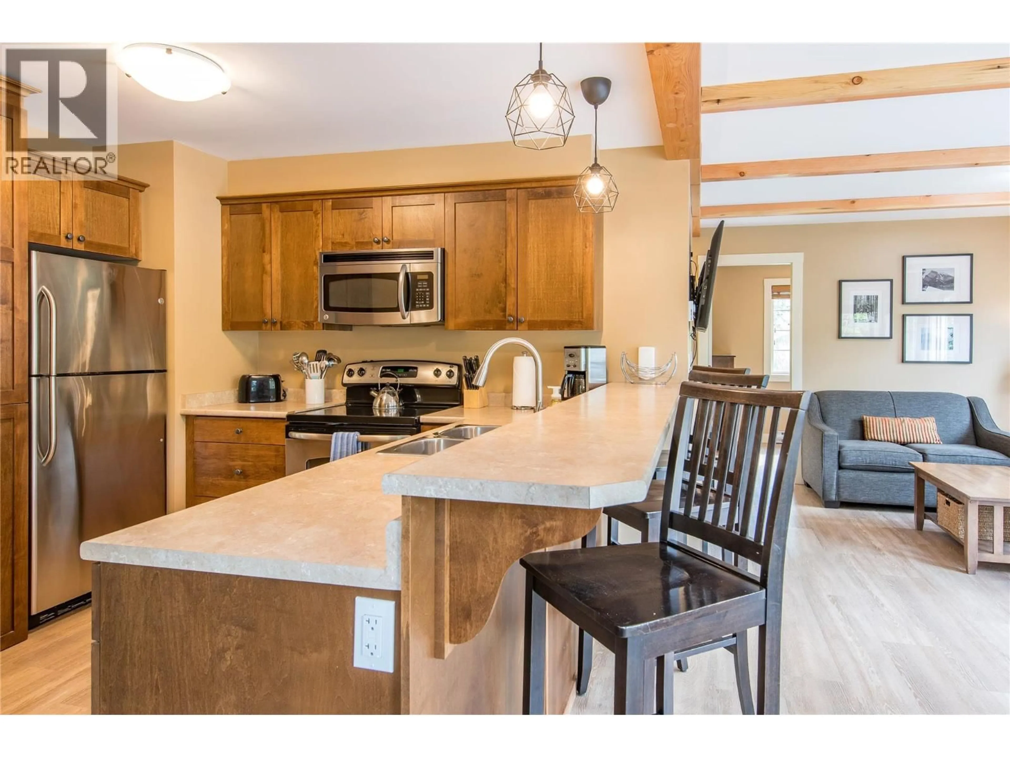 Open concept kitchen, wood/laminate floor for 21 - 1345 AEMMER WAY, Golden British Columbia V0A1H2