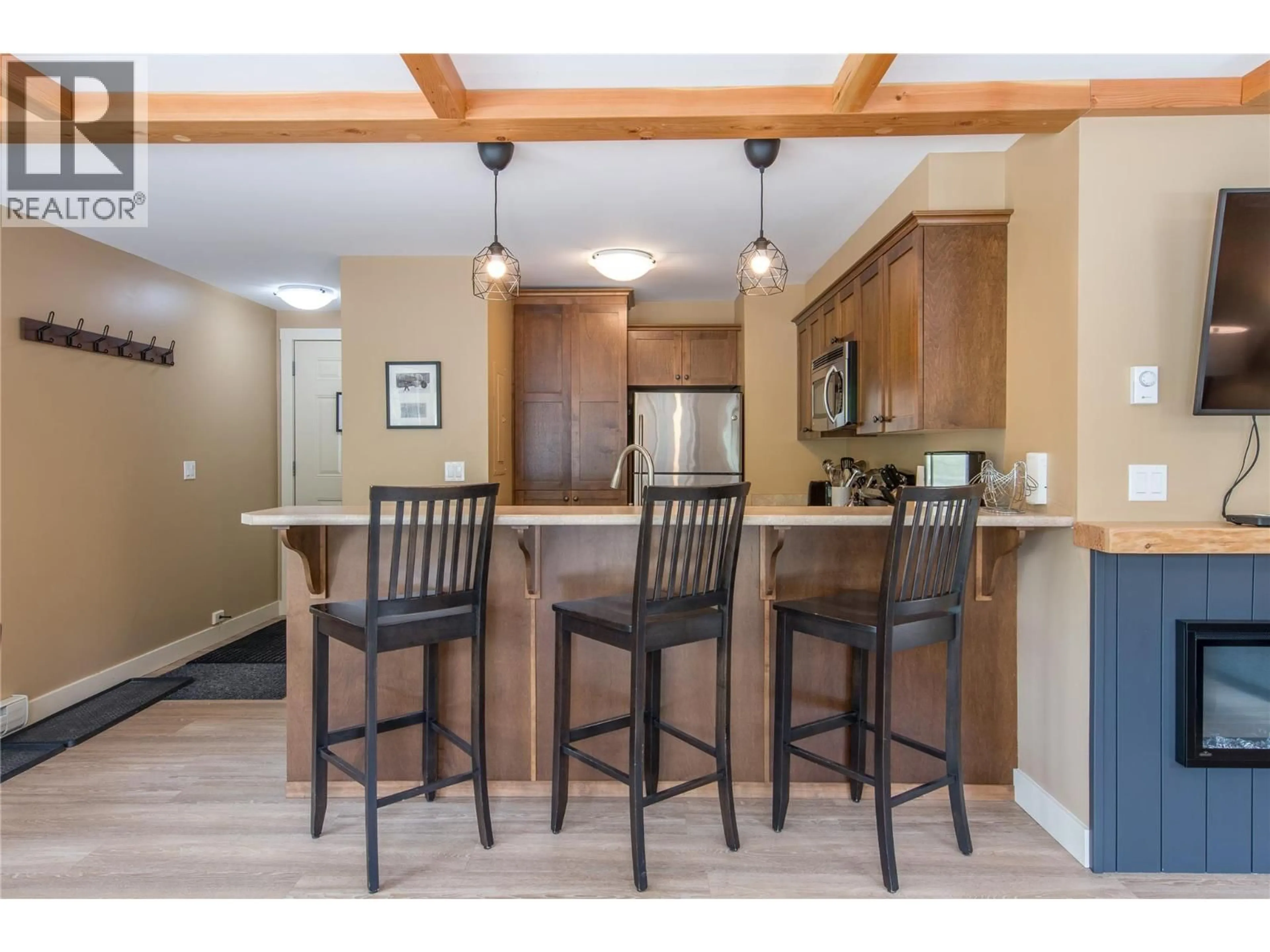 Open concept kitchen, wood/laminate floor for 21 - 1345 AEMMER WAY, Golden British Columbia V0A1H2