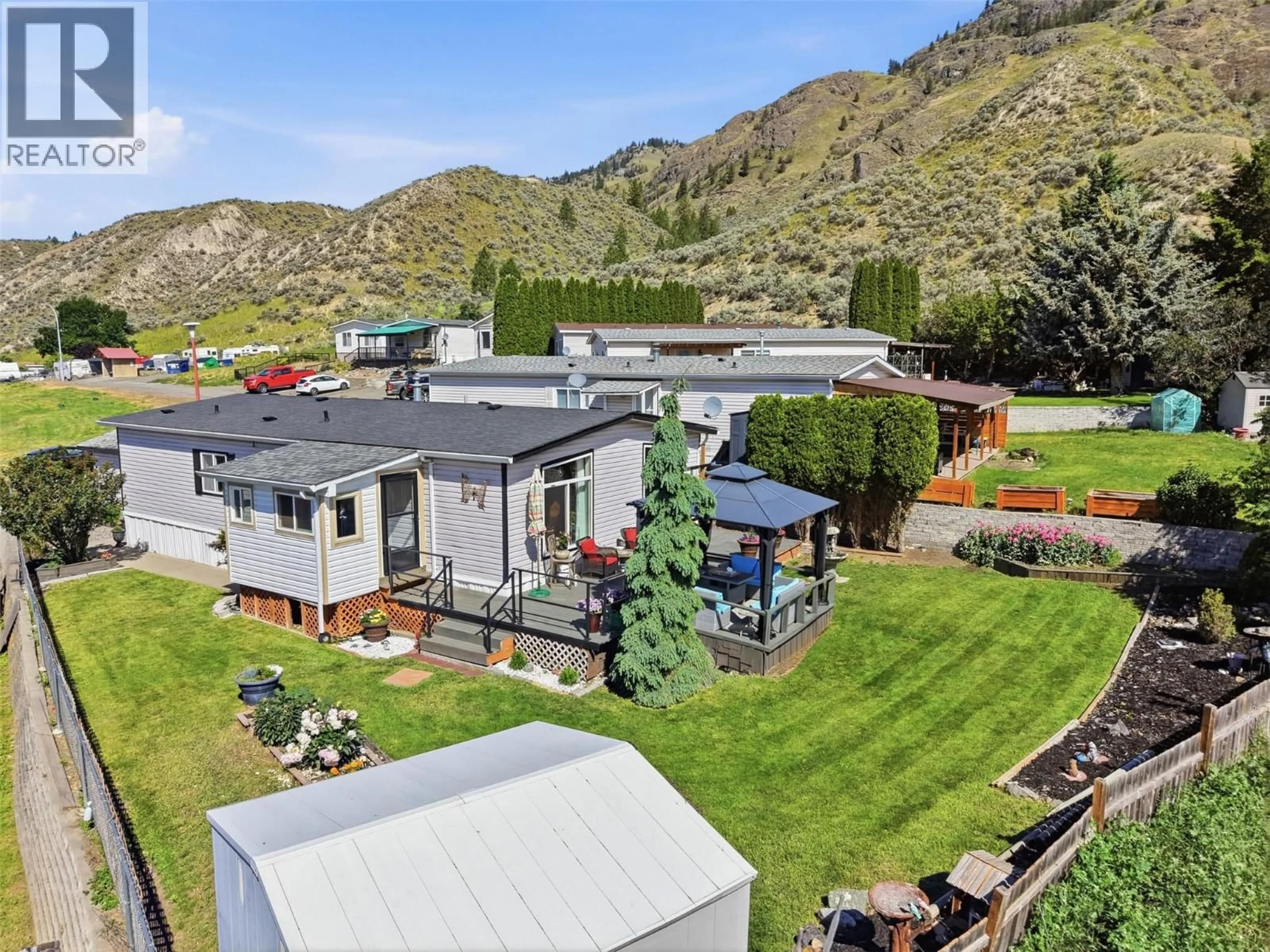 A pic from outside/outdoor area/front of a property/back of a property/a pic from drone, mountain view for 35-3099 SHUSWAP ROAD, Kamloops British Columbia V2H1T7
