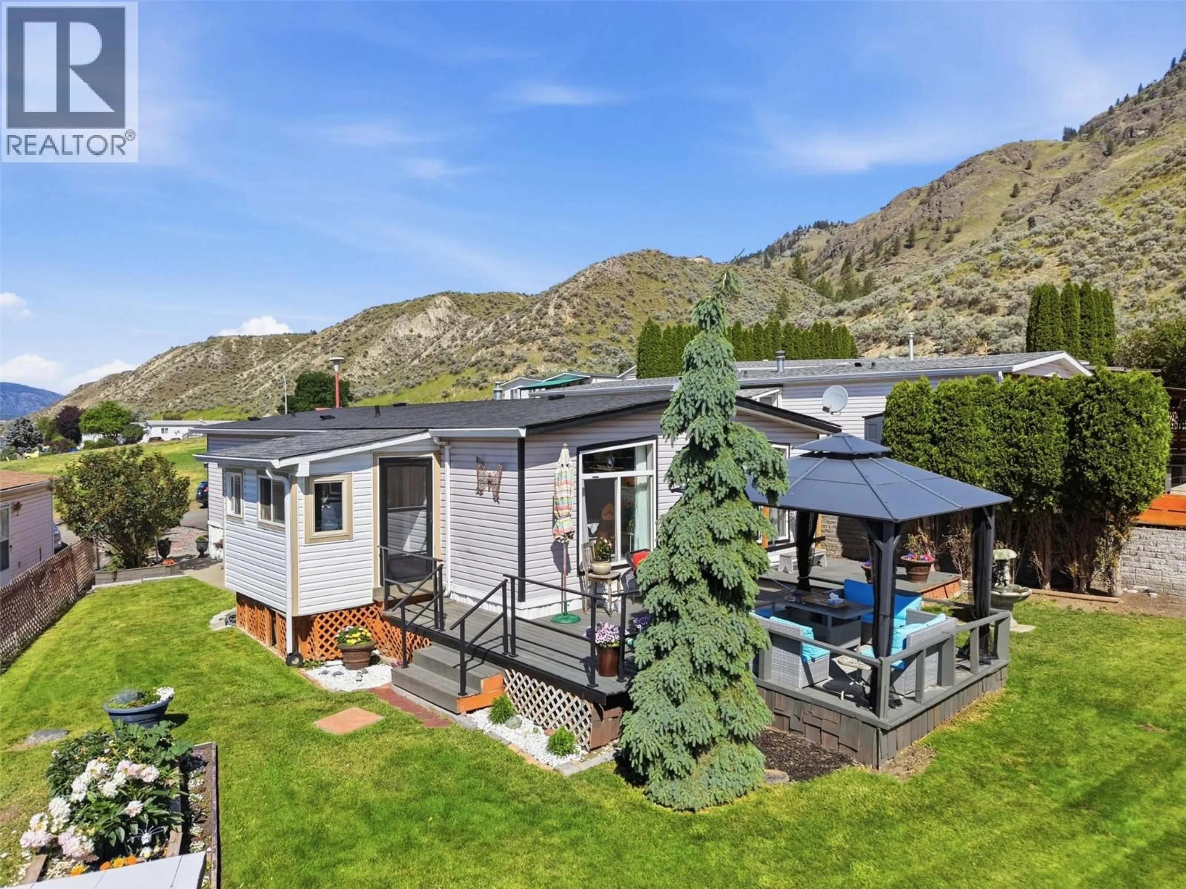 A pic from outside/outdoor area/front of a property/back of a property/a pic from drone, mountain view for 35-3099 SHUSWAP ROAD, Kamloops British Columbia V2H1T7
