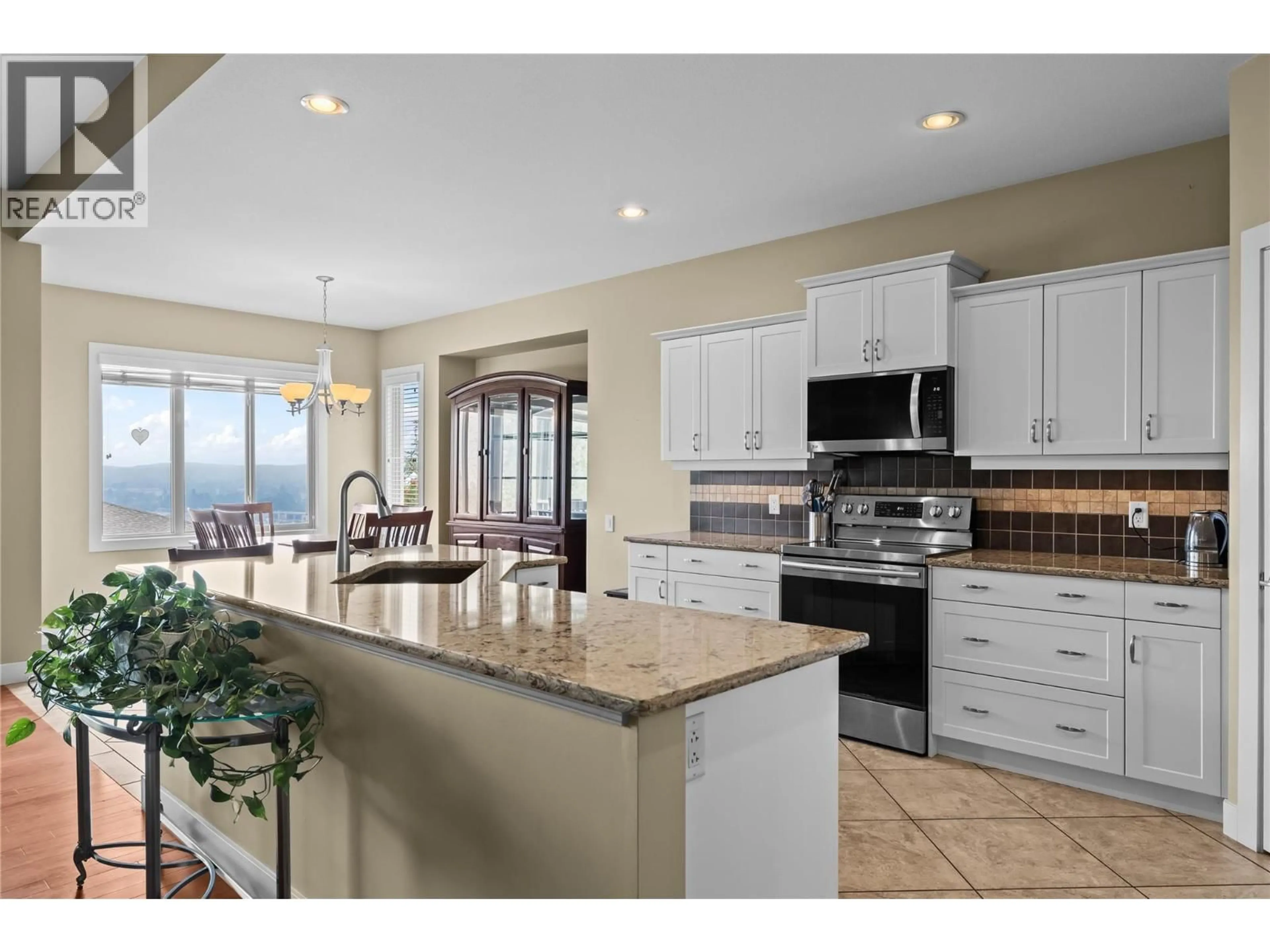 Open concept kitchen, ceramic/tile floor for 2 - 2421 GLACIER COURT, Kelowna British Columbia V1V3A6