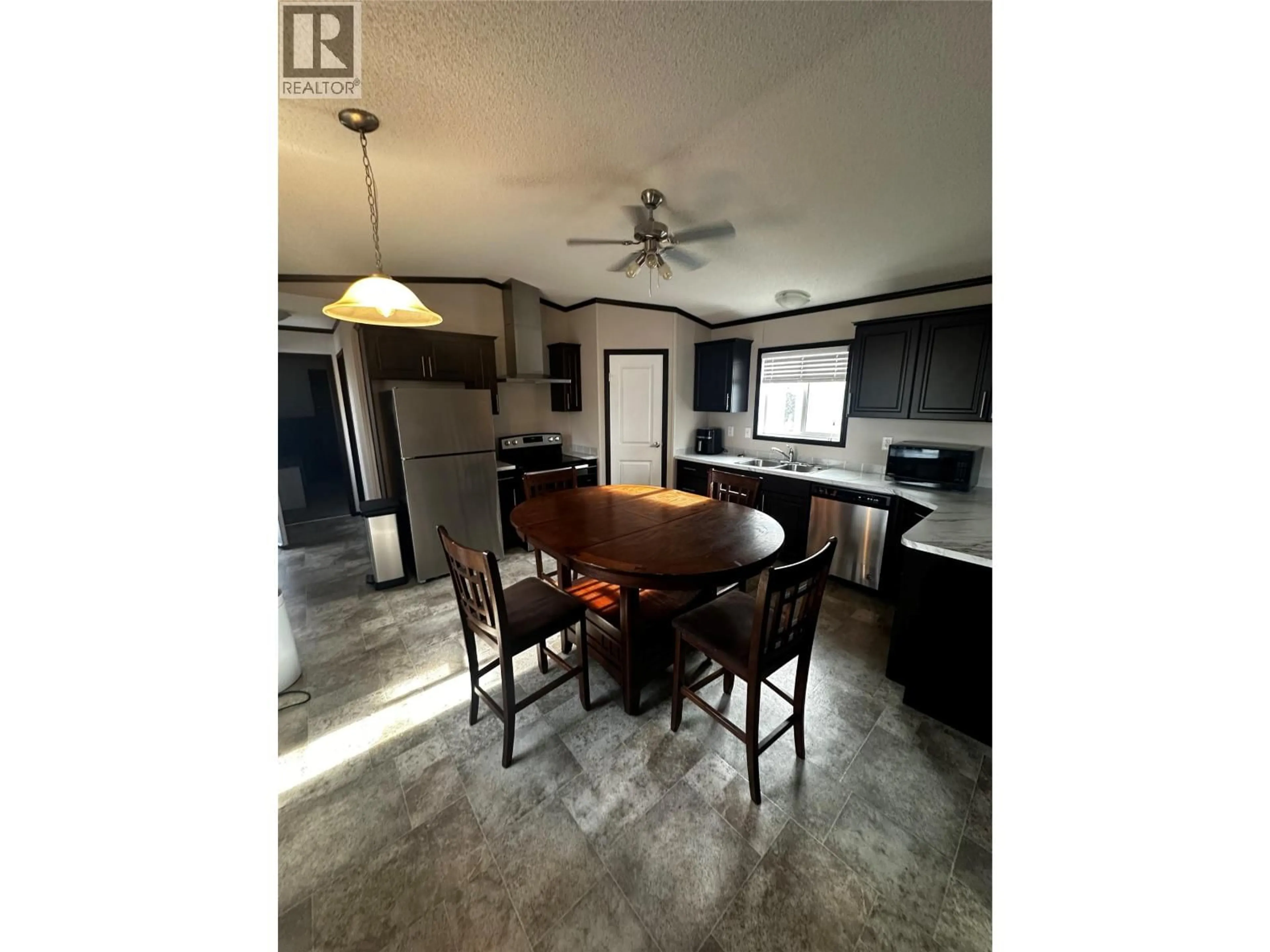 Open concept kitchen, cement floor for 5207&5209 43 STREET, Chetwynd British Columbia V0C1J0