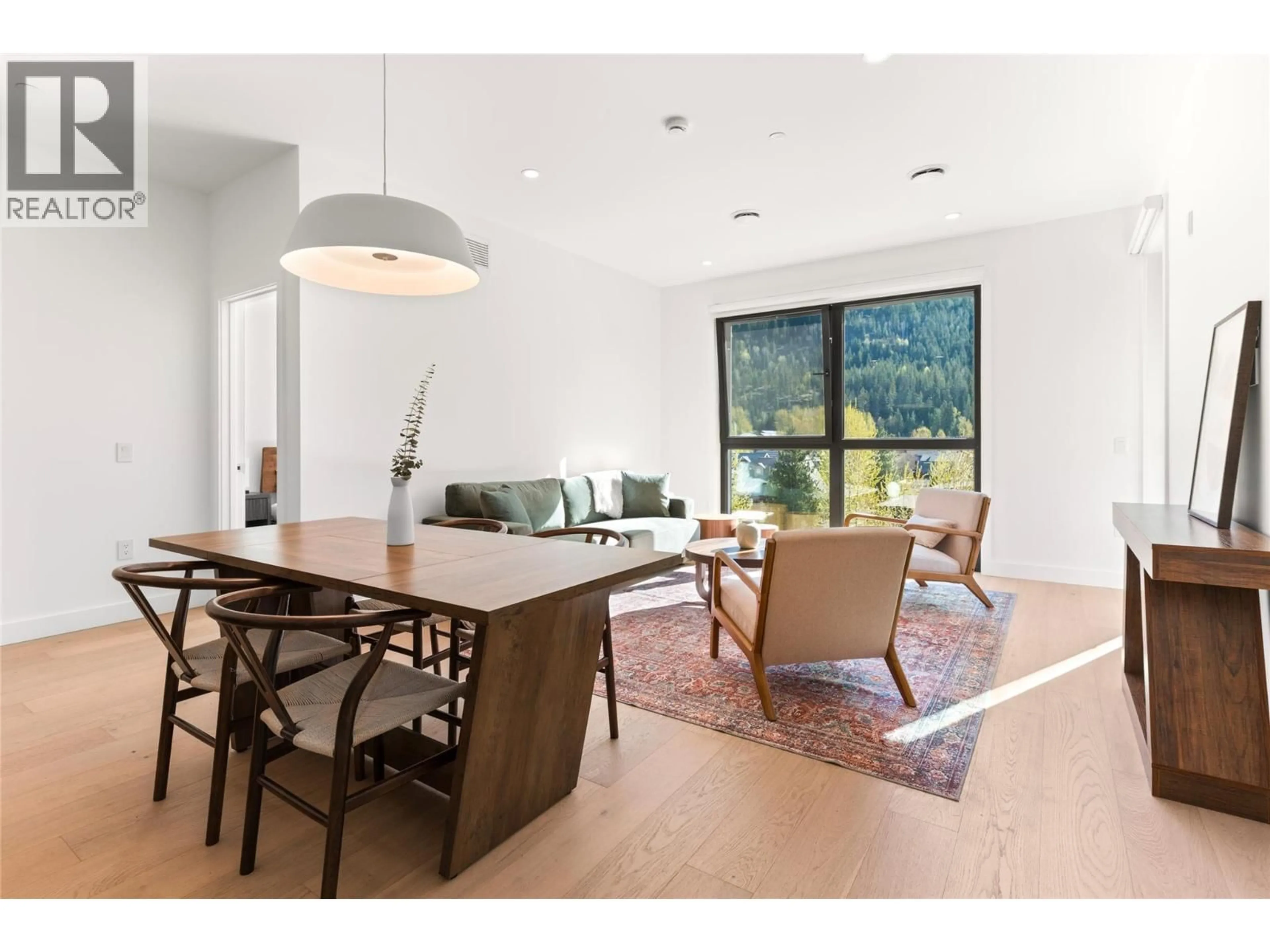 Open concept kitchen, wood/laminate floor for 1406 - 1702 COURSIER AVENUE, Revelstoke British Columbia V0E2S1