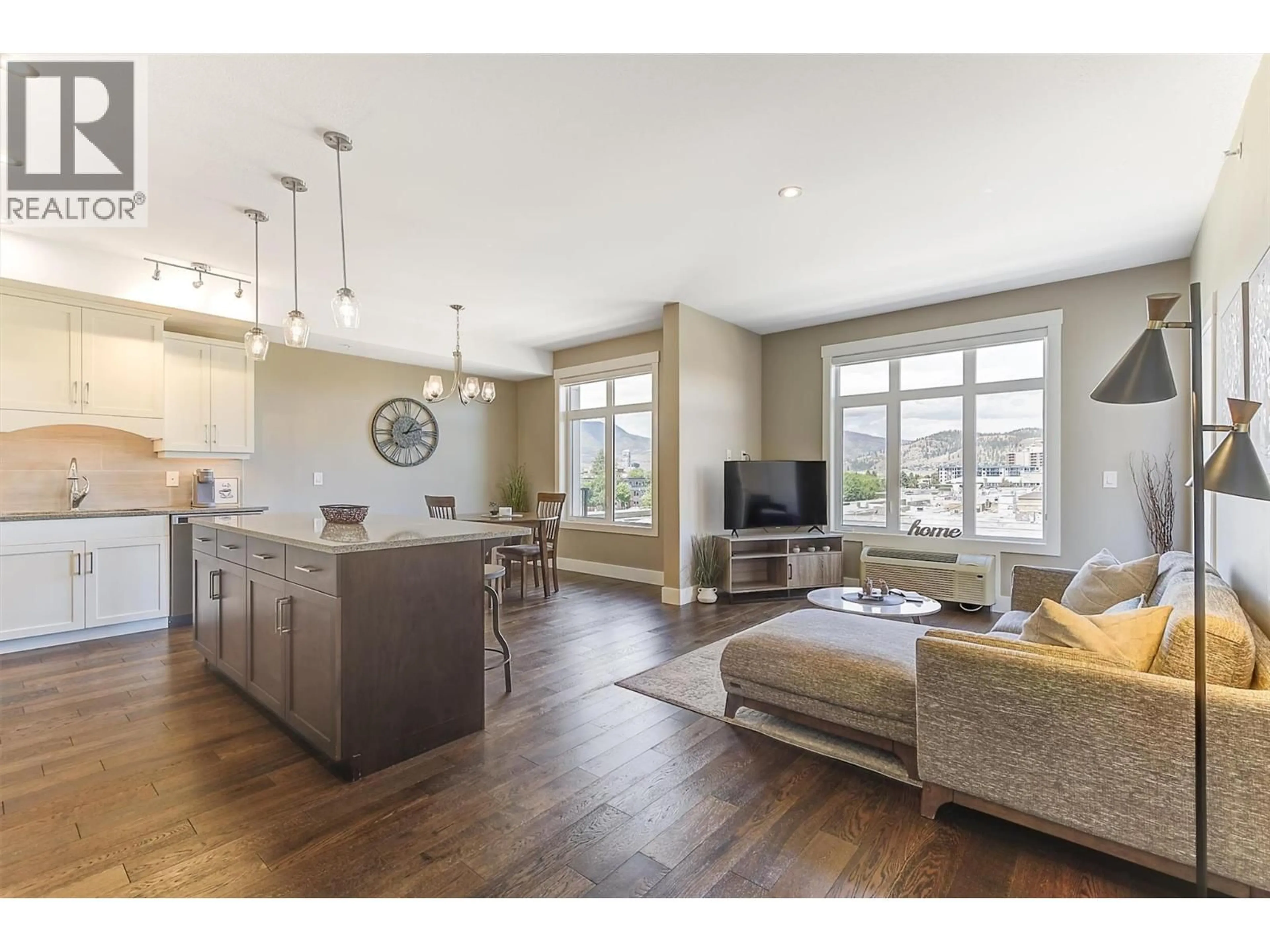 Open concept kitchen, wood/laminate floor for 405 - 1165 SUTHERLAND AVENUE, Kelowna British Columbia V1Y0J3