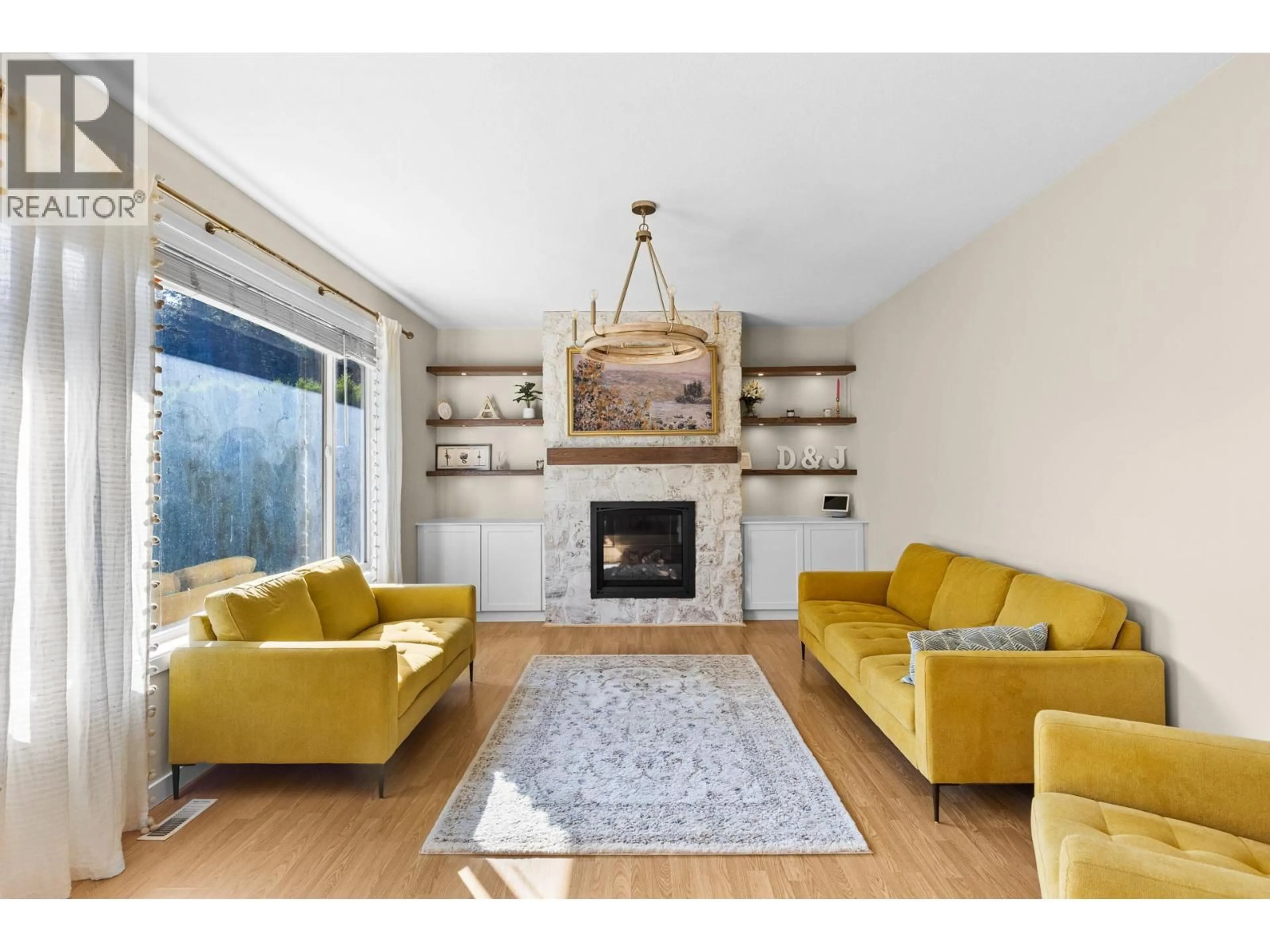 Living room with furniture, wood/laminate floor for 2954 SANDSTONE DRIVE, West Kelowna British Columbia V4T1T2