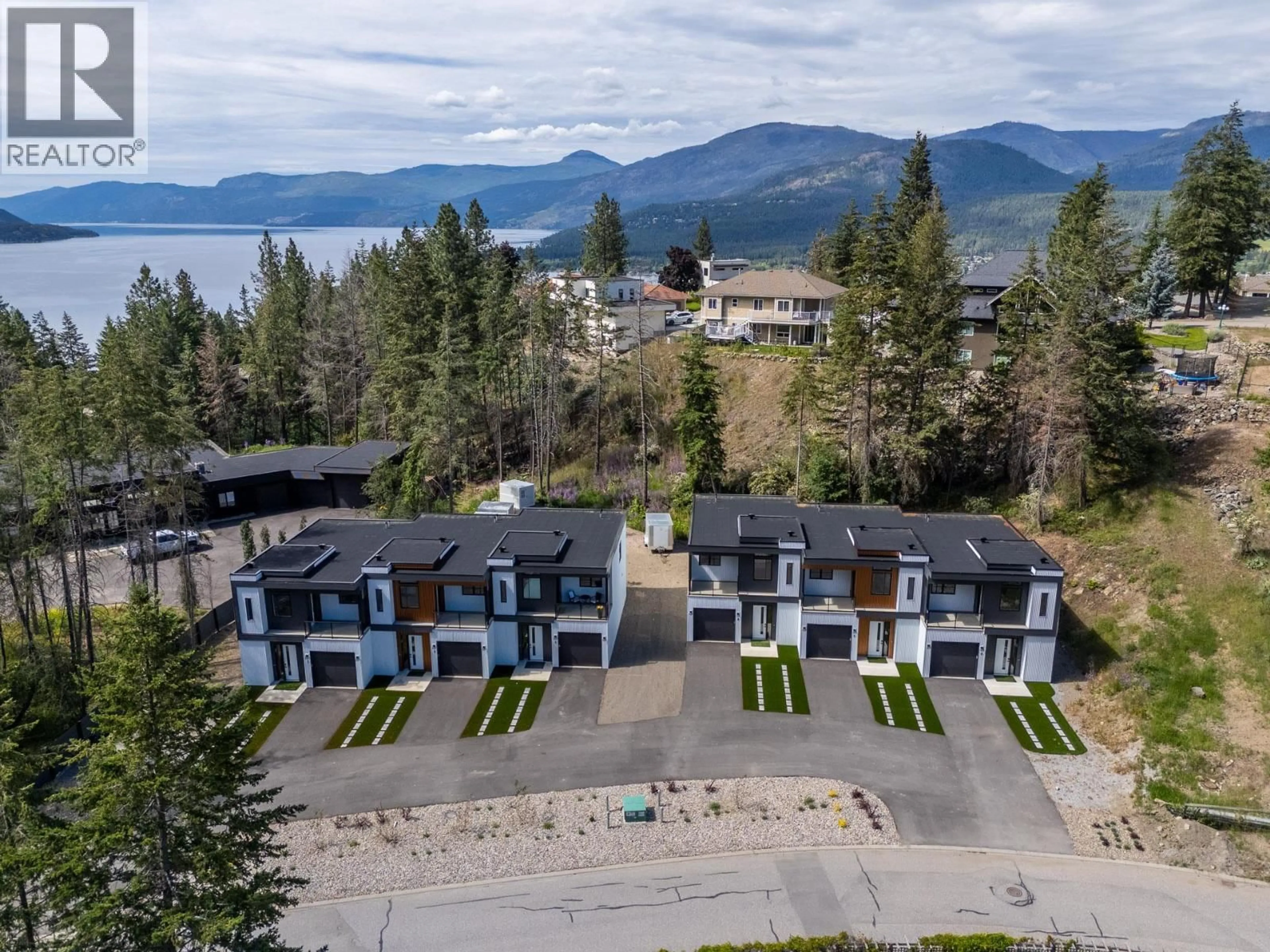 A pic from outside/outdoor area/front of a property/back of a property/a pic from drone, mountain view for 5 - 9188 TRONSON ROAD, Vernon British Columbia V1H1E2
