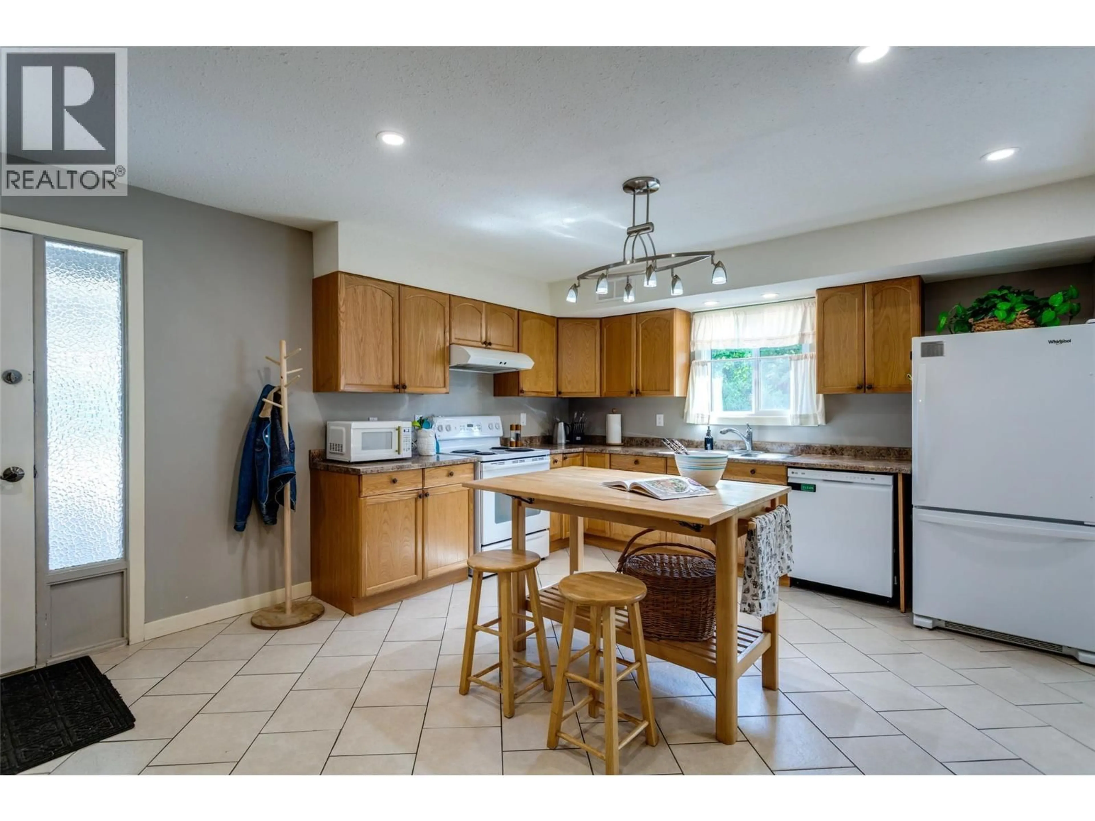Open concept kitchen, ceramic/tile floor for 1 - 500 LESTER ROAD, Kelowna British Columbia V1X6E2