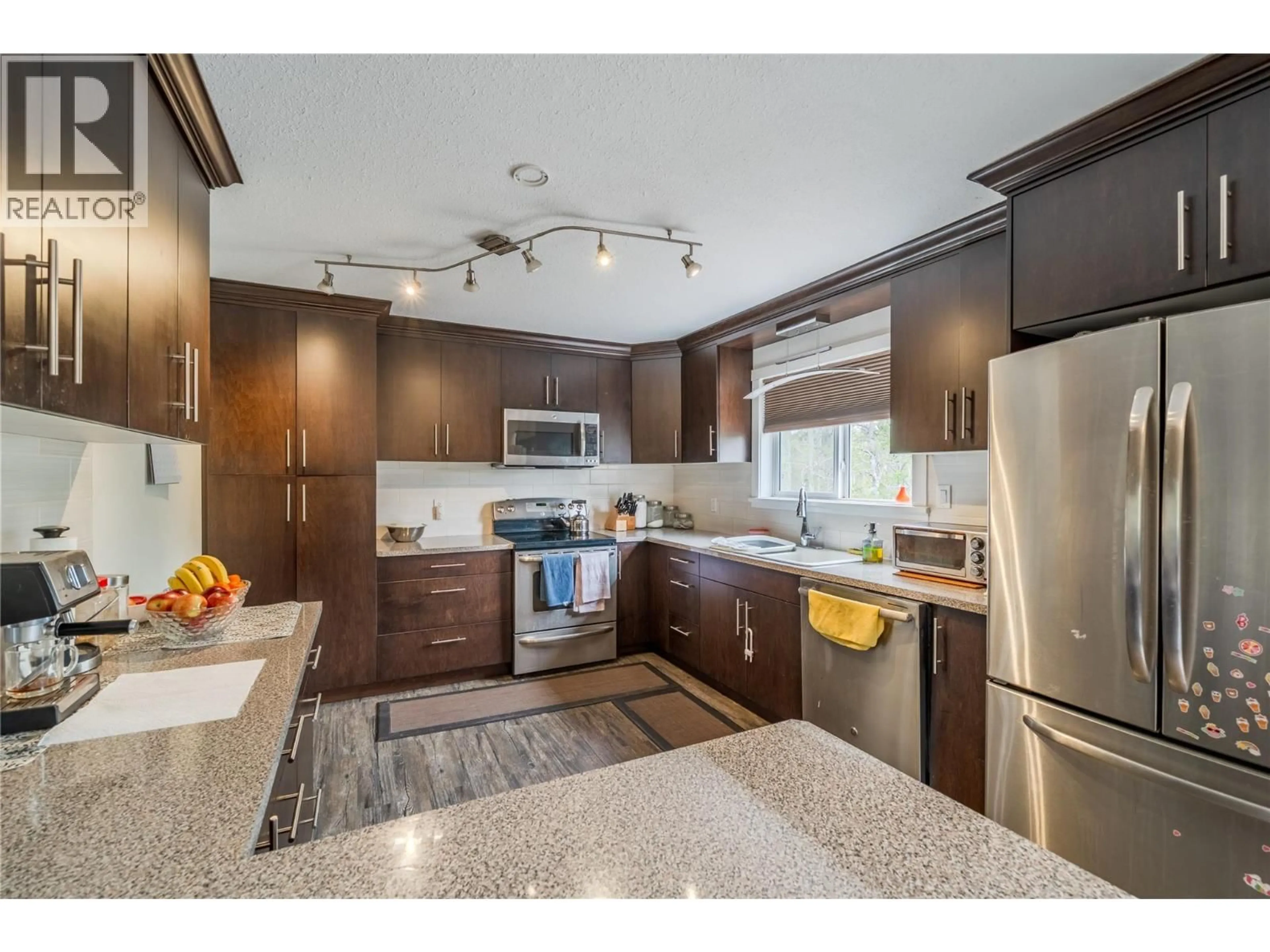Open concept kitchen, unknown for 1912 CHASM ROAD, 70 Mile House British Columbia V0K2K0