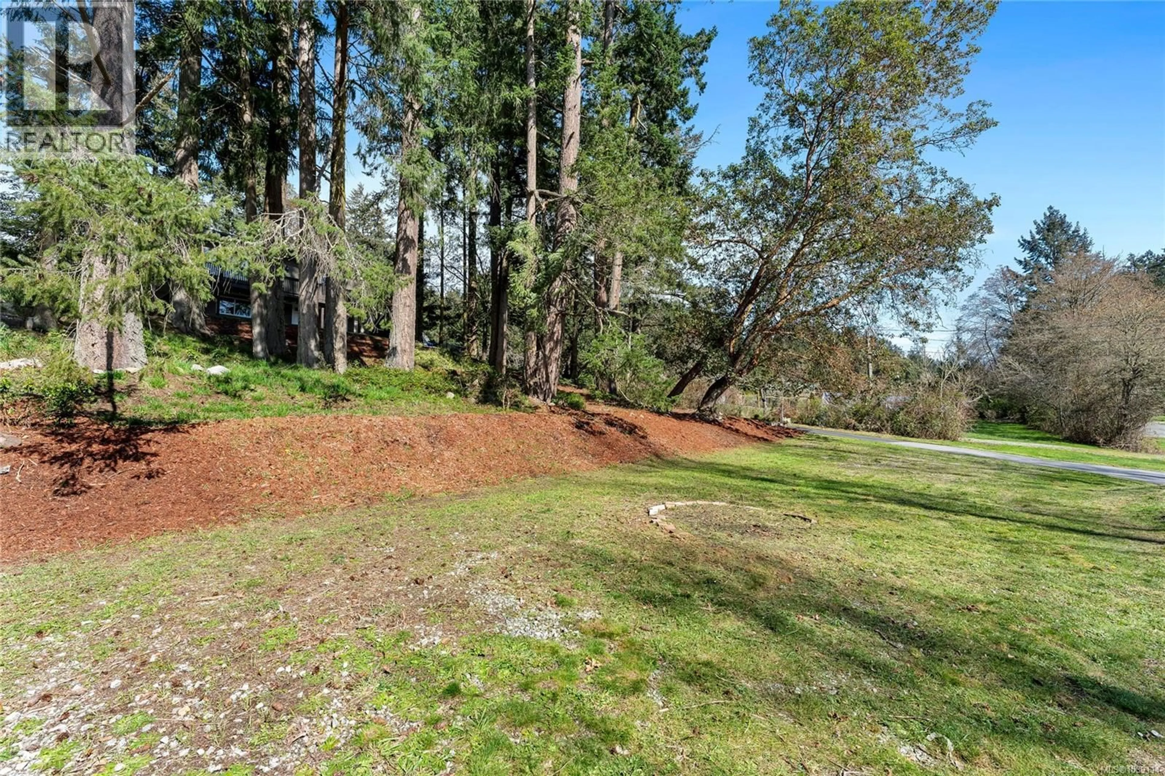 A pic from outside/outdoor area/front of a property/back of a property/a pic from drone, forest/trees view for 1084 TATLOW ROAD, North Saanich British Columbia V8L5P3