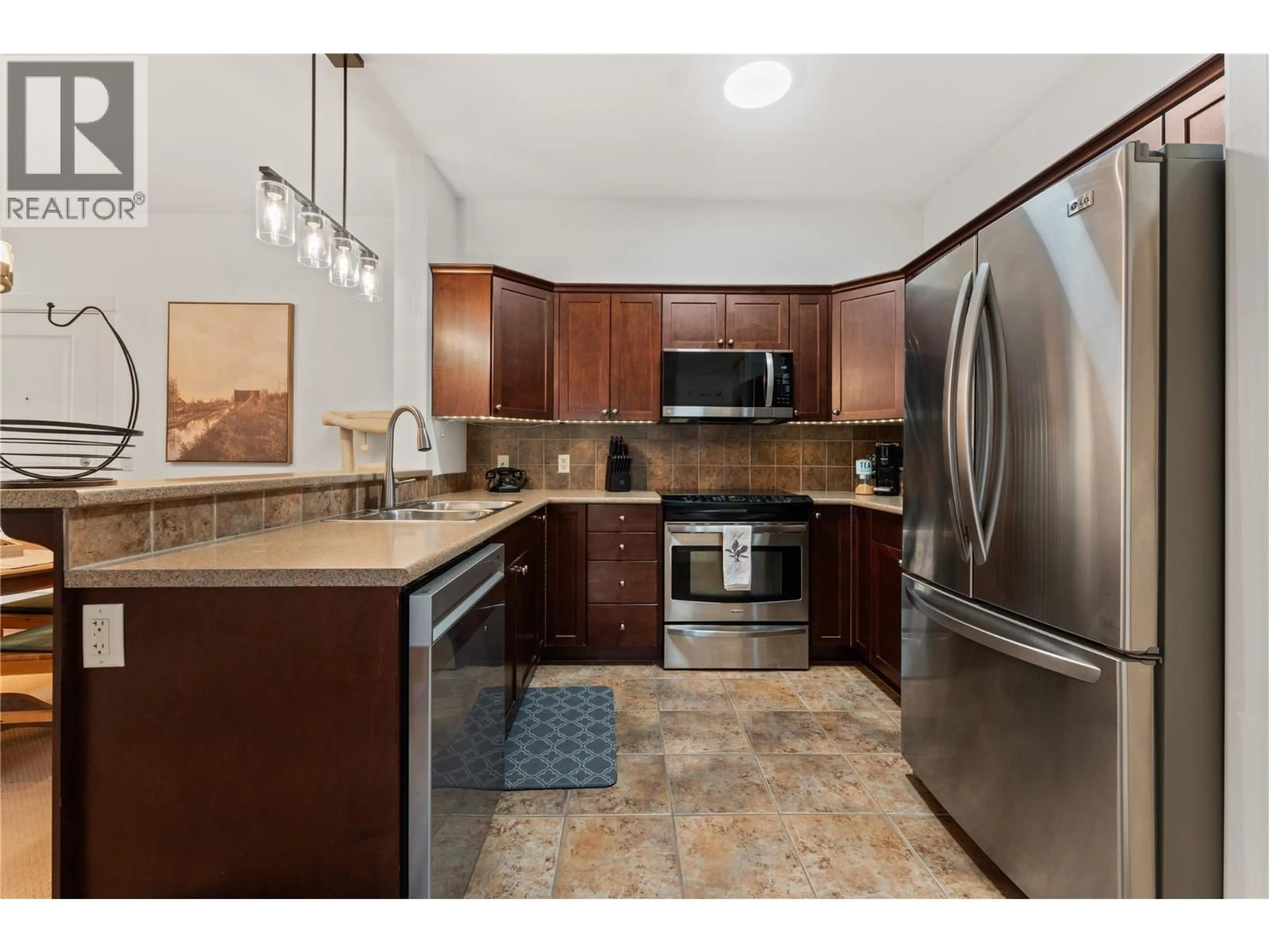 Standard kitchen, ceramic/tile floor for 114 - 2611 STILLWATER WAY, Lake Country British Columbia V4V2R3