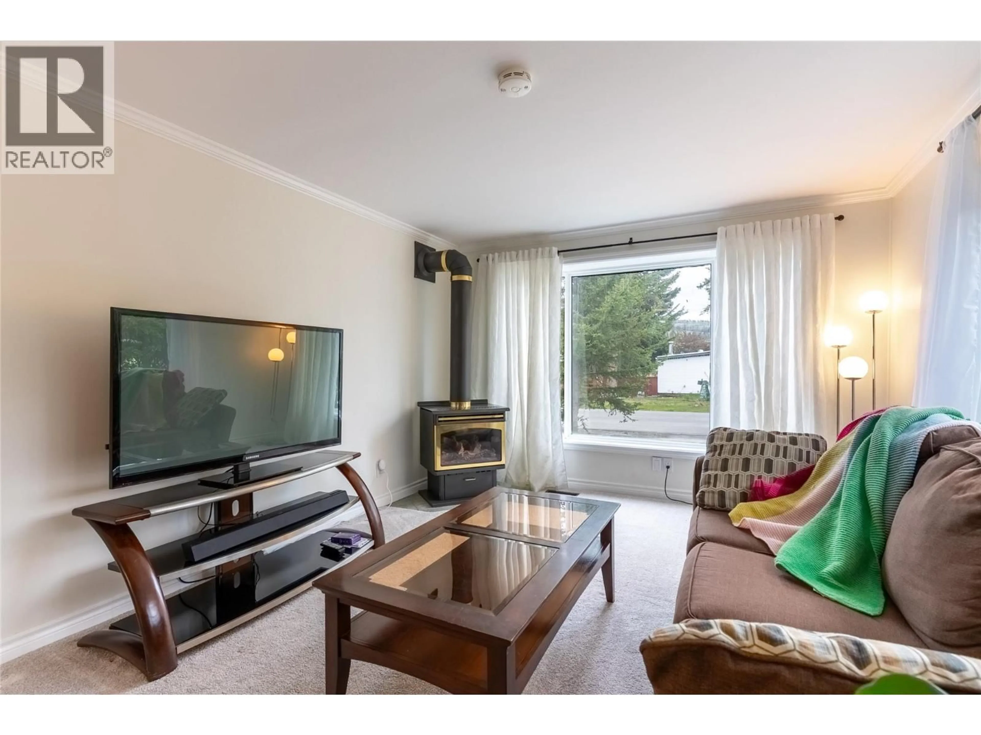 Living room with furniture, wood/laminate floor for 5 COPPER COURT, Logan Lake British Columbia V0K1W0