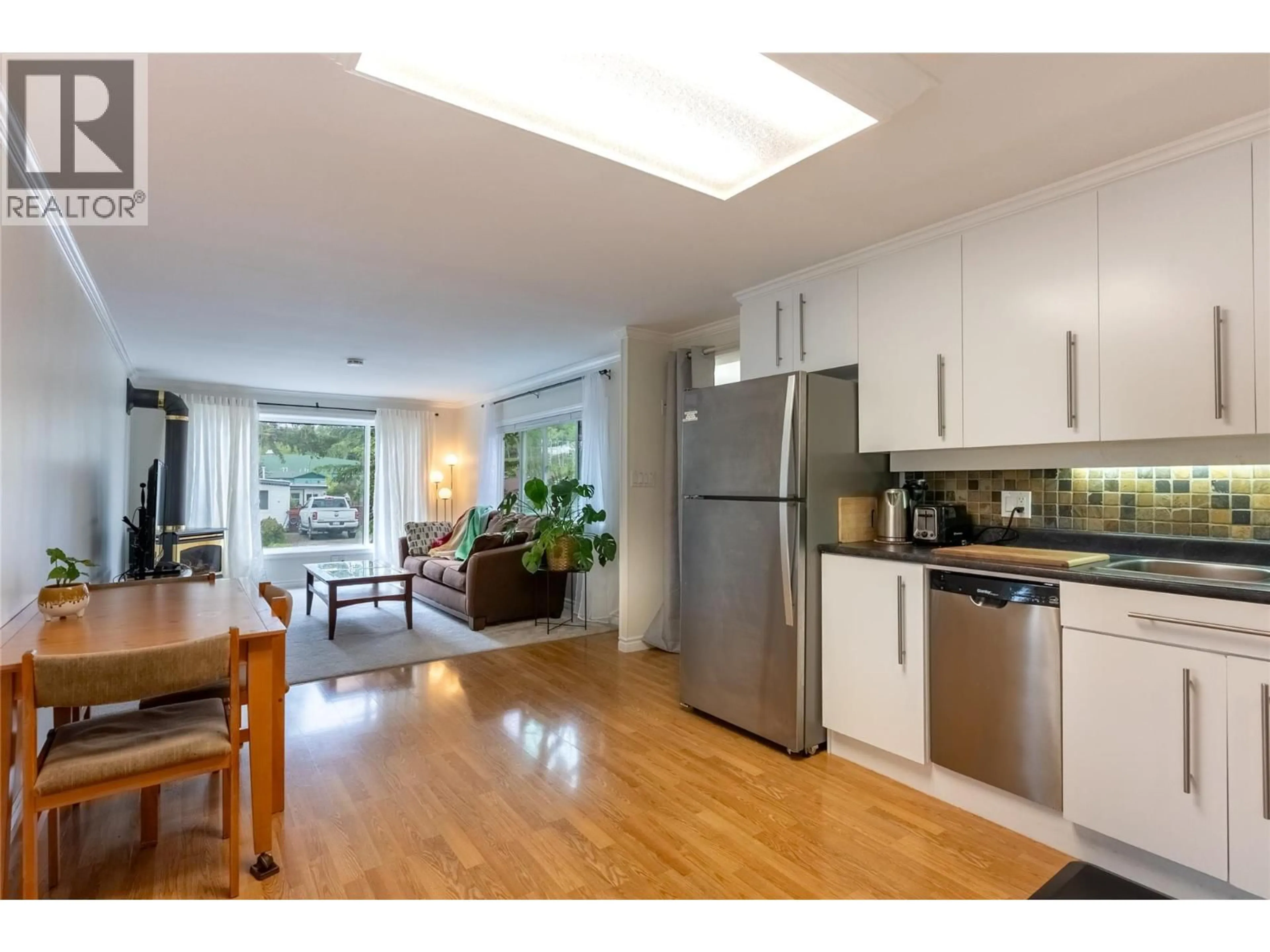 Open concept kitchen, wood/laminate floor for 5 COPPER COURT, Logan Lake British Columbia V0K1W0