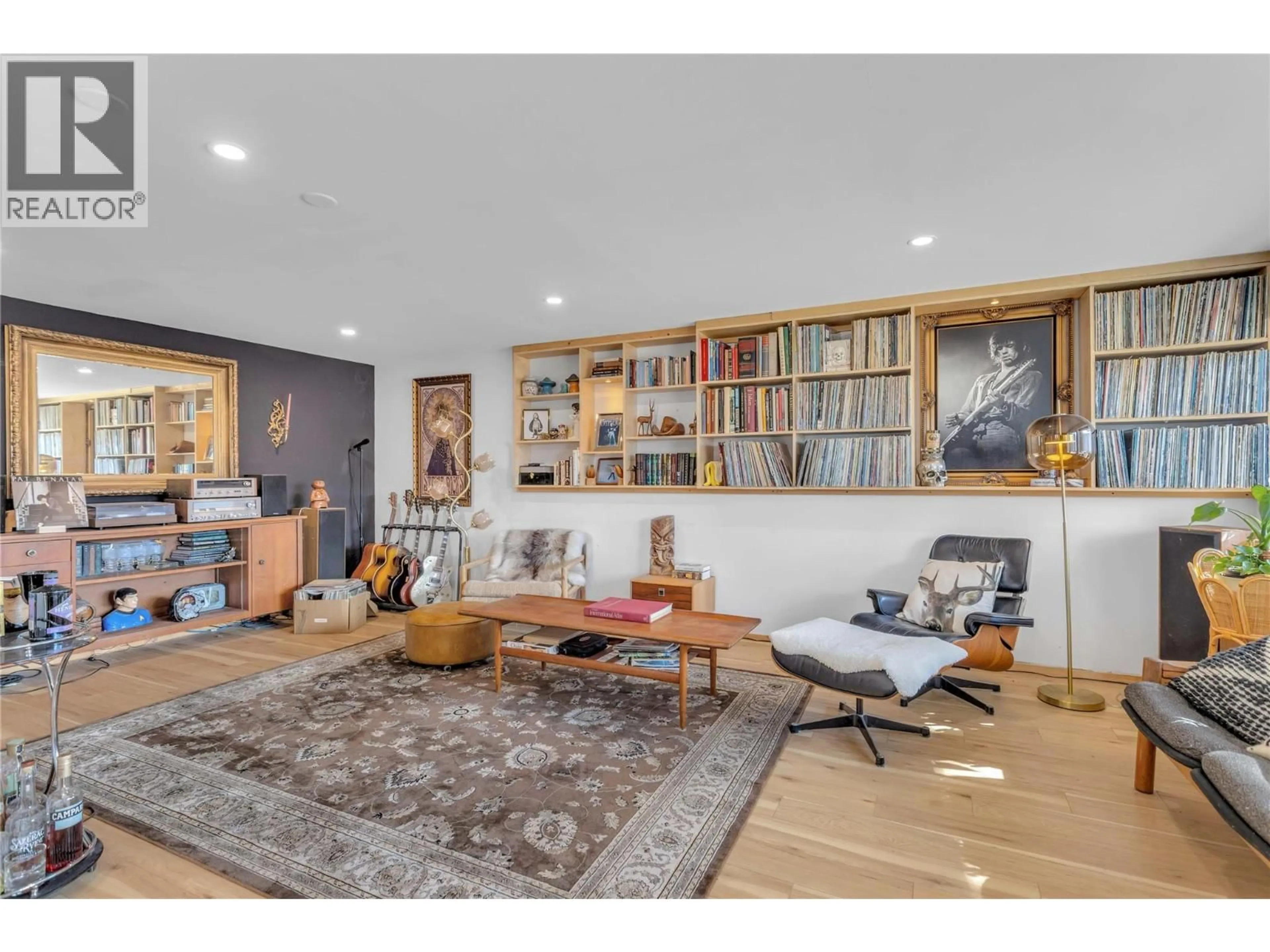 Living room with furniture, wood/laminate floor for 3991 DESERT PINES AVENUE, Peachland British Columbia V0H1X2