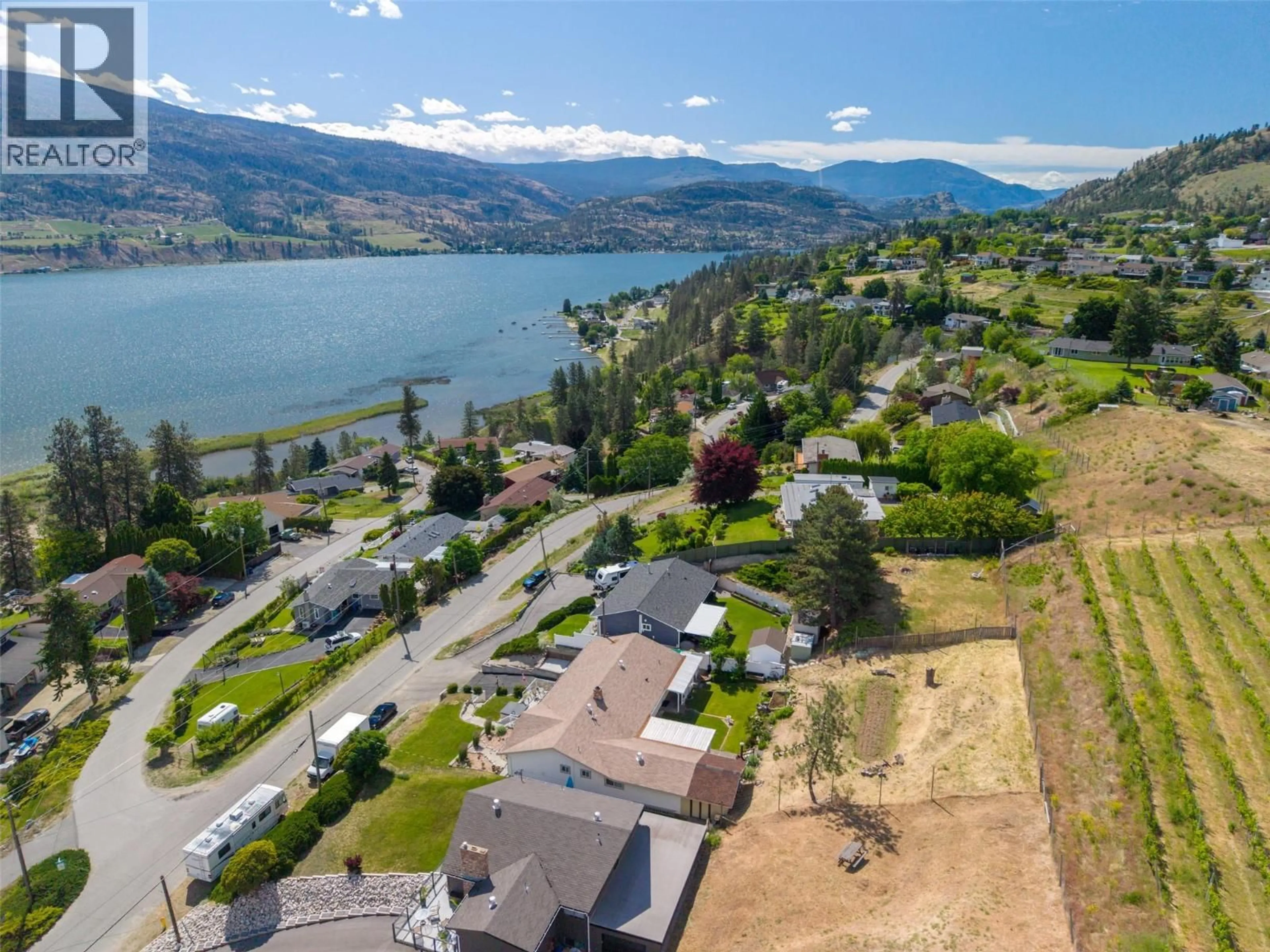 A pic from outside/outdoor area/front of a property/back of a property/a pic from drone, water/lake/river/ocean view for 465 PINEVIEW DRIVE, Kaleden British Columbia V0H1K0