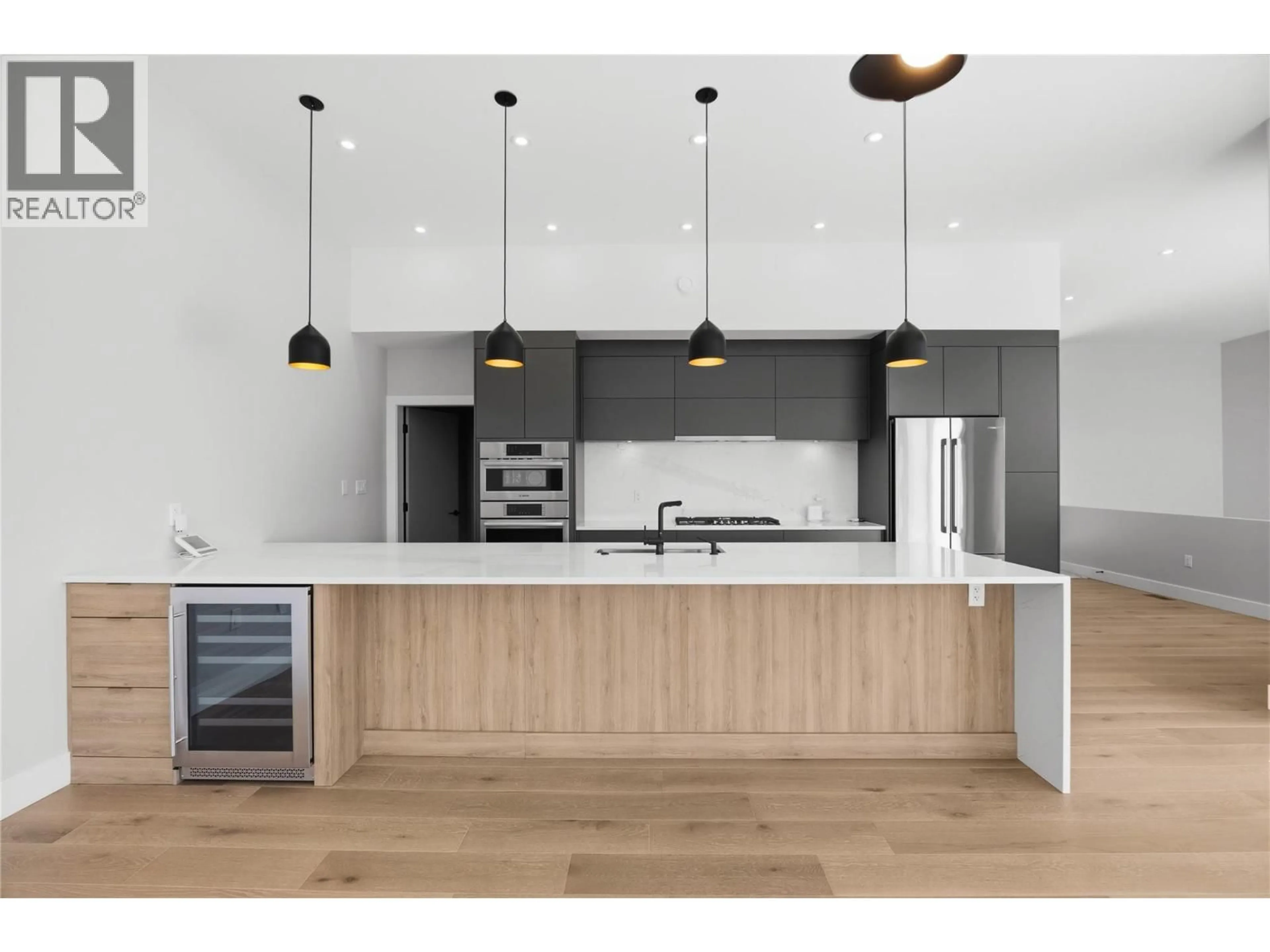 Contemporary kitchen, wood/laminate floor for 1106 SYER ROAD, Penticton British Columbia V2A9G4