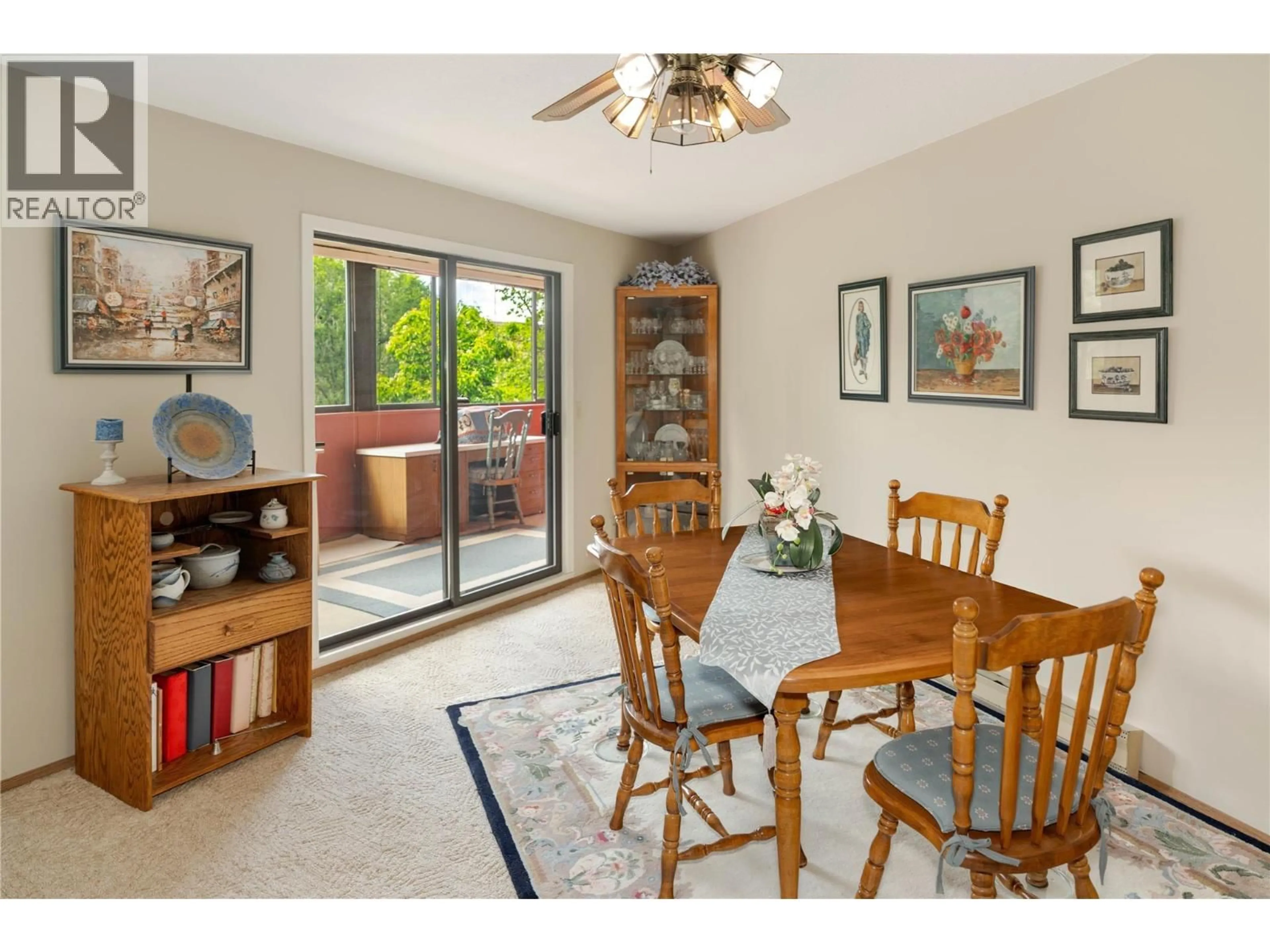 Dining room, wood/laminate floor for 306 - 1640 UFTON COURT, Kelowna British Columbia V1Y8L5