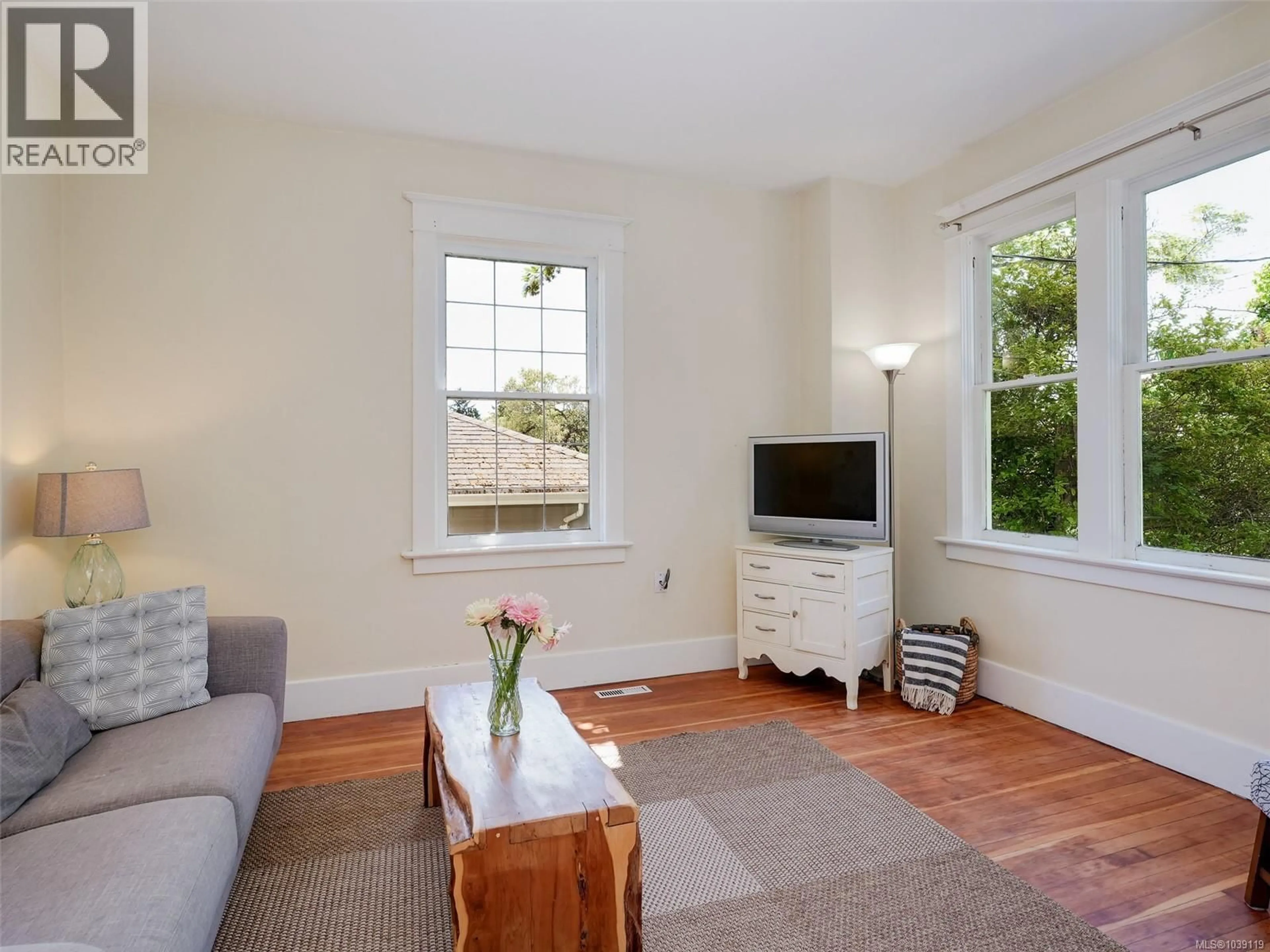 Living room with furniture, wood/laminate floor for 2623 MT. STEPHEN AVENUE, Victoria British Columbia V8T3L5
