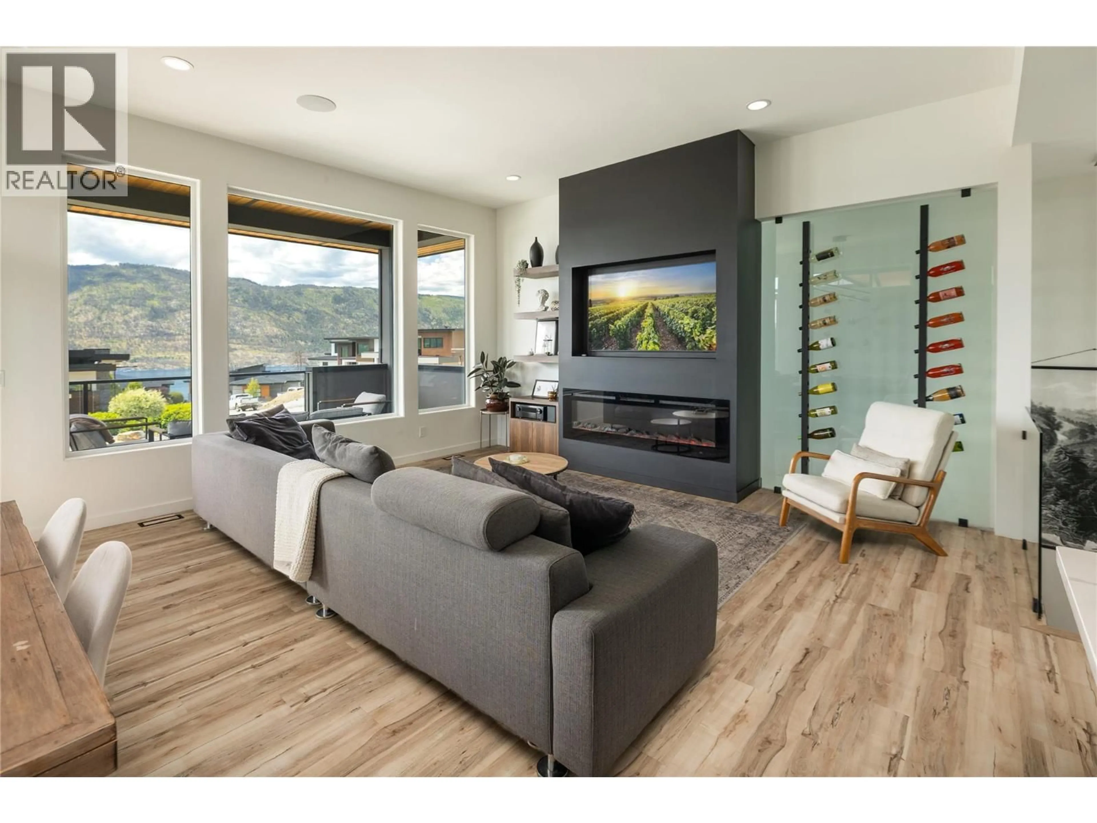 Living room with furniture, wood/laminate floor for 9499 LEDGESTONE ROAD, Lake Country British Columbia V4V0A4
