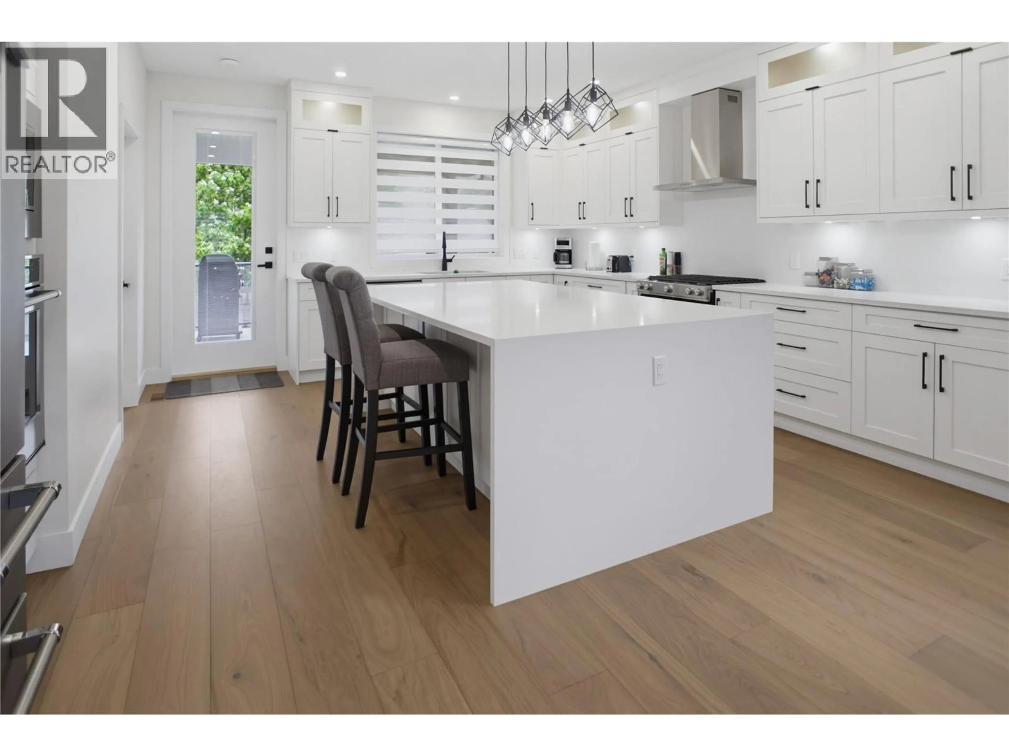 Open concept kitchen, wood/laminate floor for 2967 GILBERT ROAD, Kamloops British Columbia V2B7A9